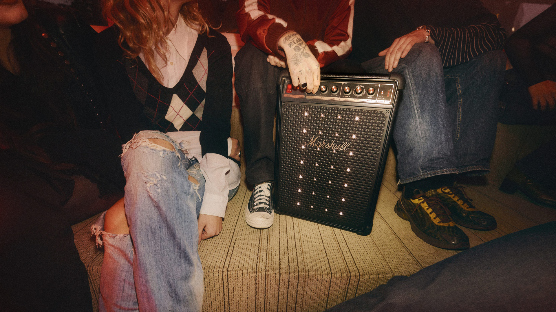 The Marshall Bromley 450 speaker surrounded by people at a party