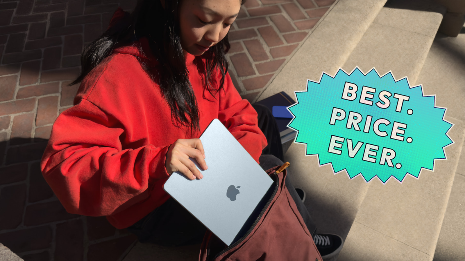 a girl putting a 13-inch m4 apple macbook air into a backpack