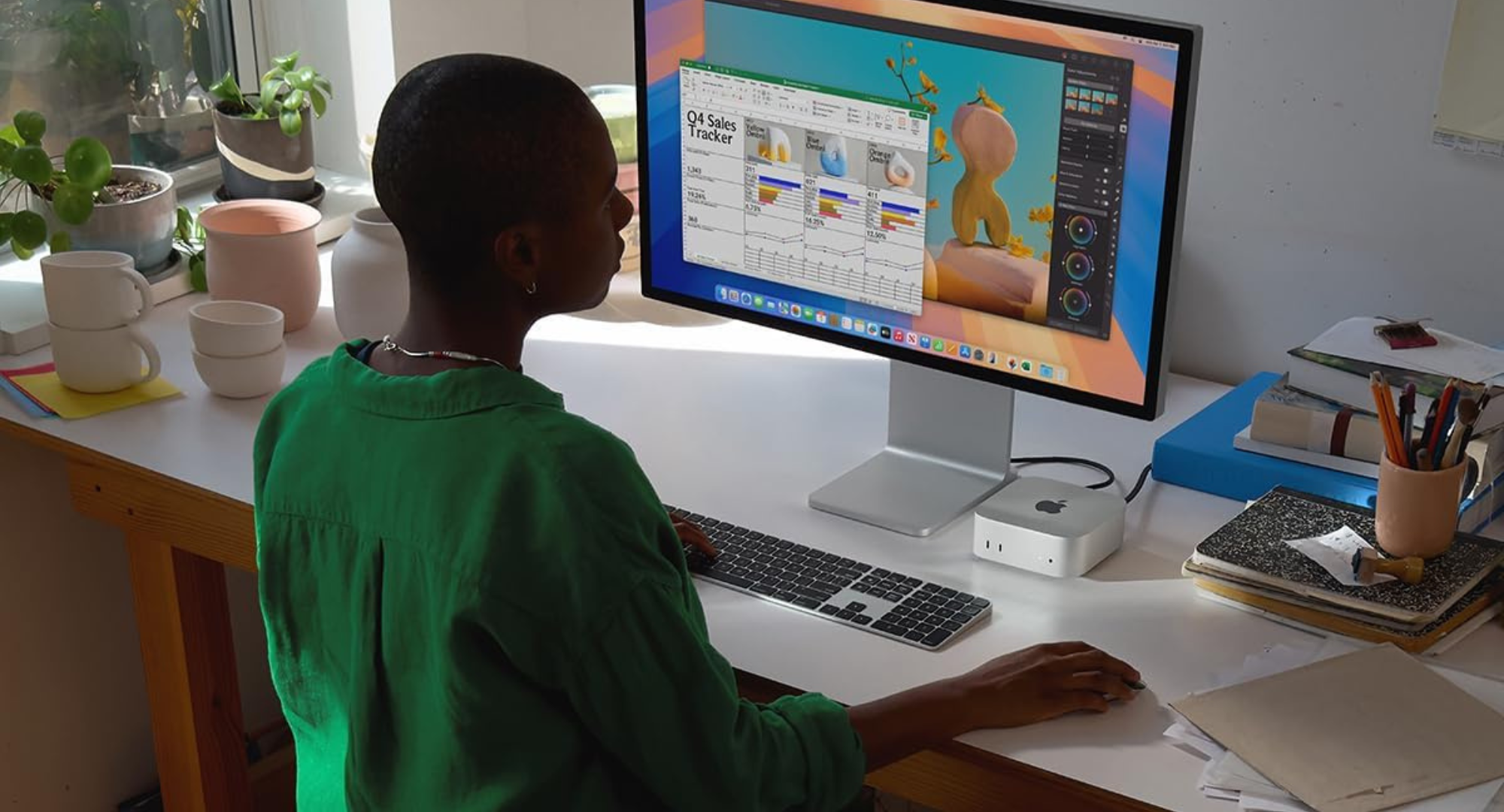 Teenager using a Mac mini 4. 