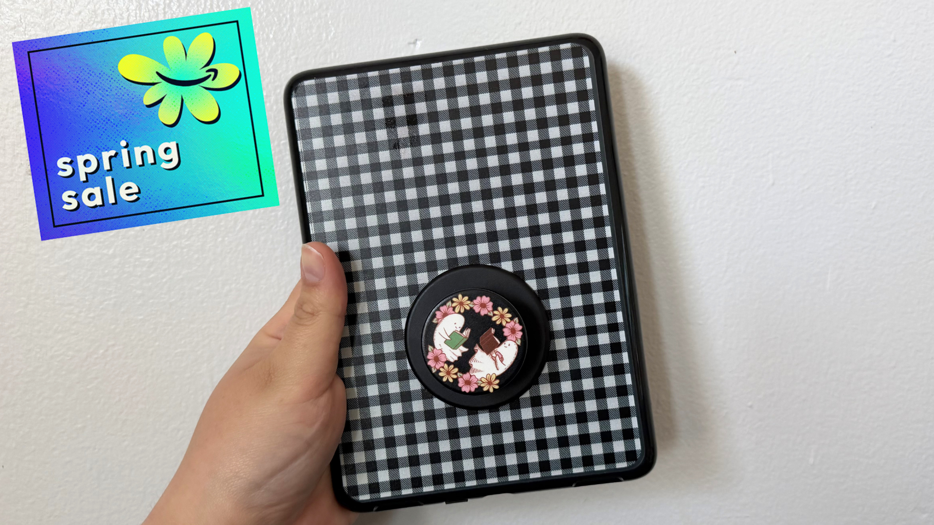 A Kindle in a PopSockets case