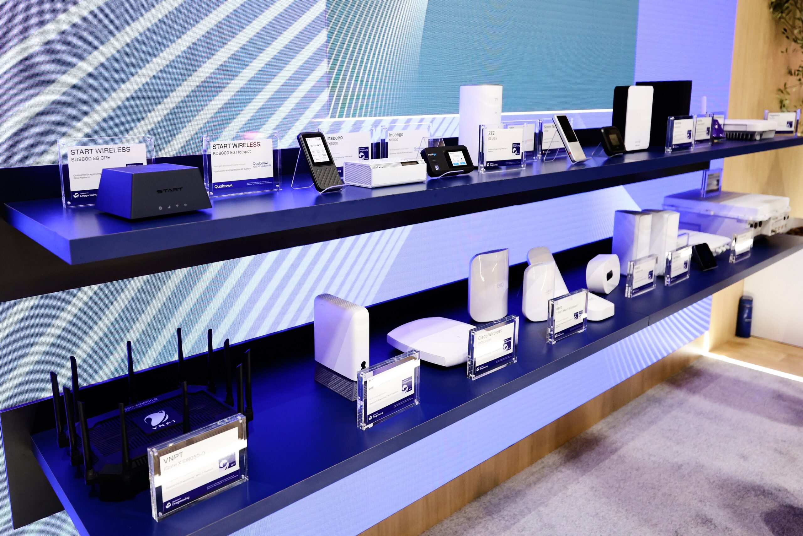Several modems and routers equipped with 5G technology are exhibited at Qualcomm's pavilion