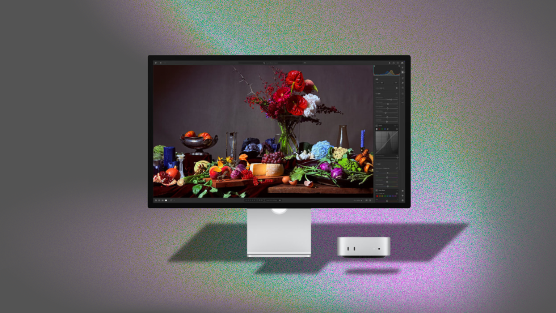 Apple Studio Display XDR monitor on gray background with colorful light leak