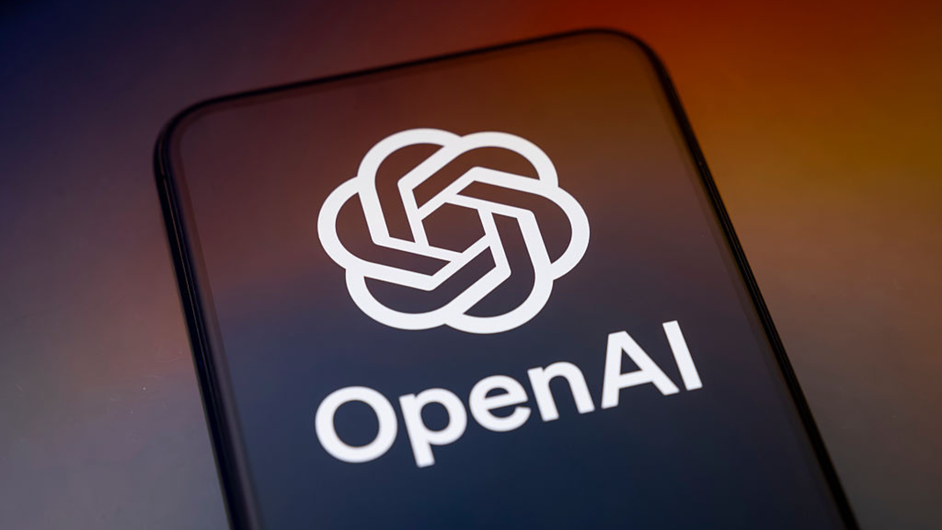 The OpenAI logo on a smartphone screen.