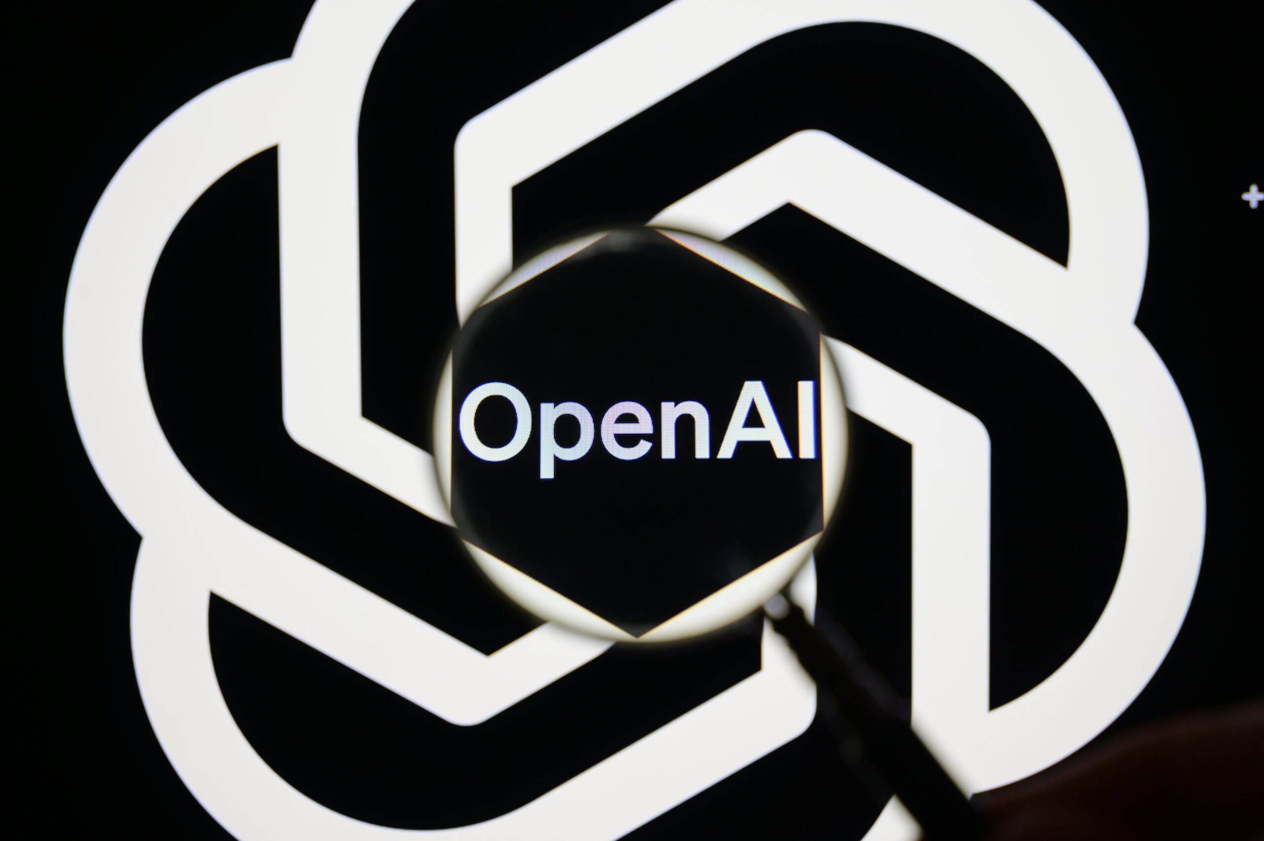 open ai logo through magnifying glass