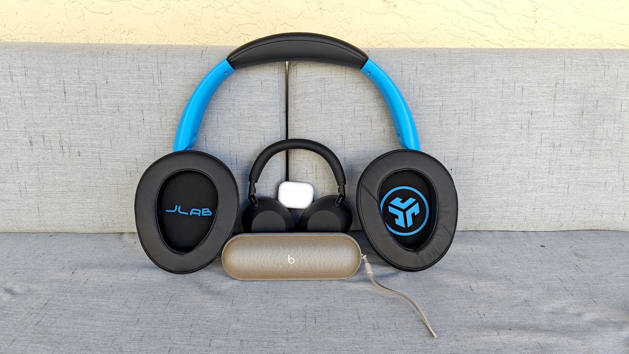 The Blue XL Speaker headphones shown with other smaller headphones and speakers.