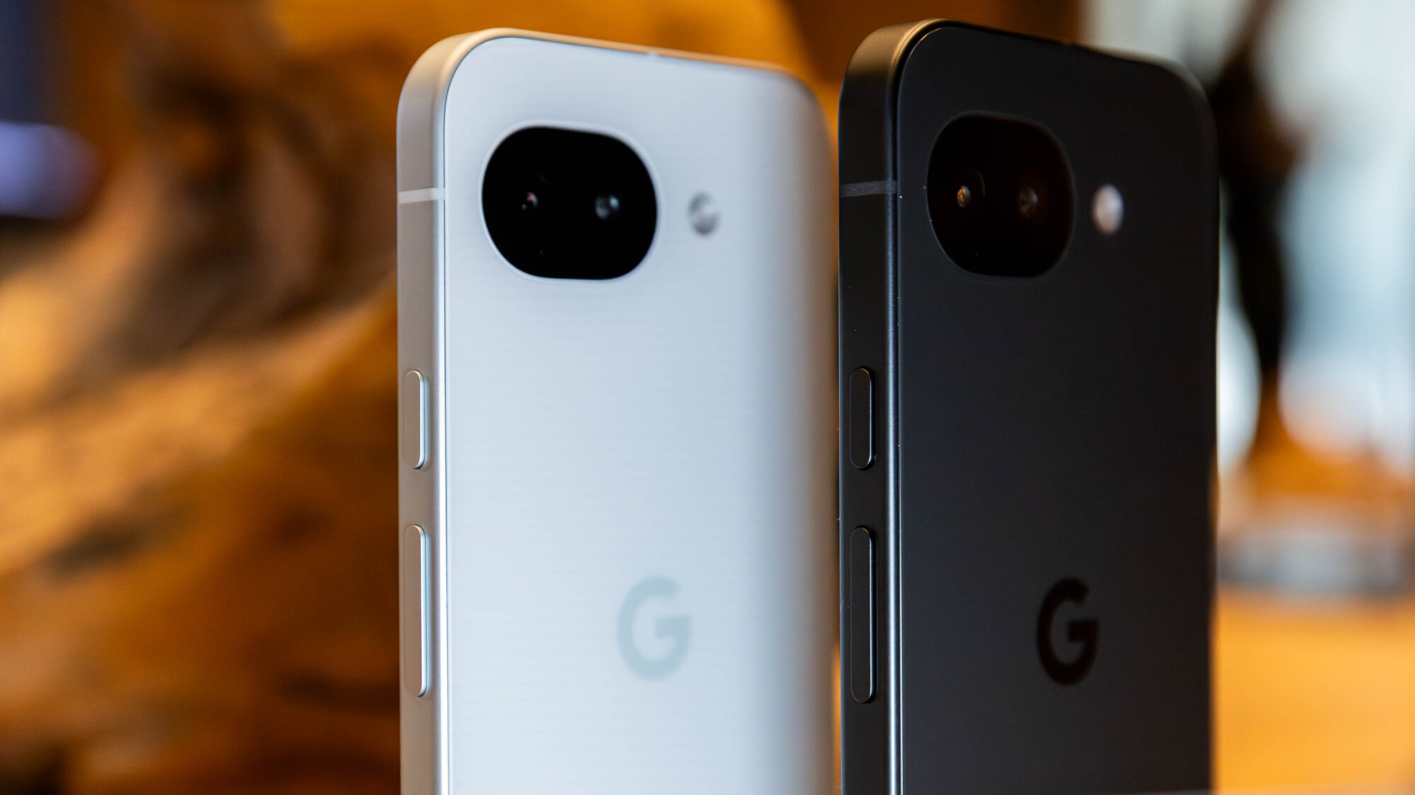 two google pixel 10a phones in white and black colors