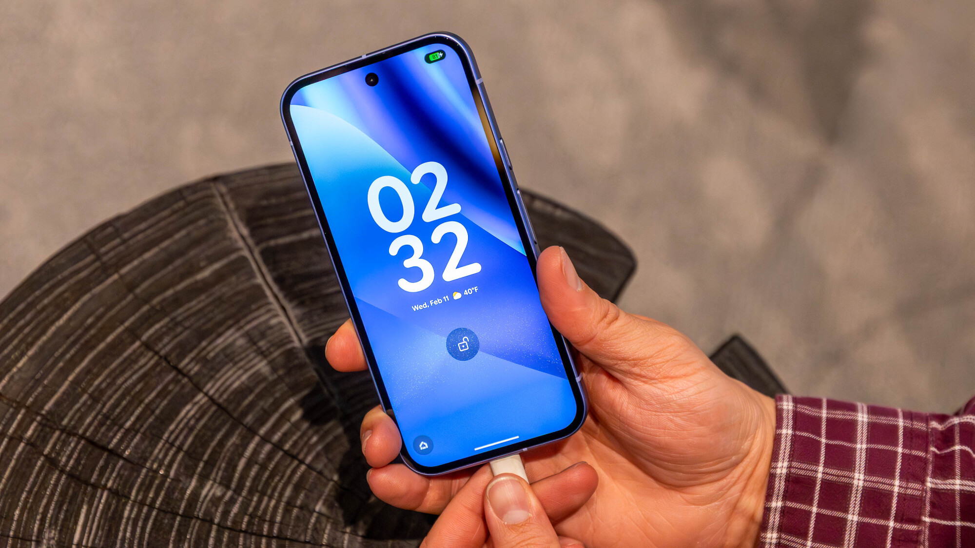 man charging google pixel 10a smartphone