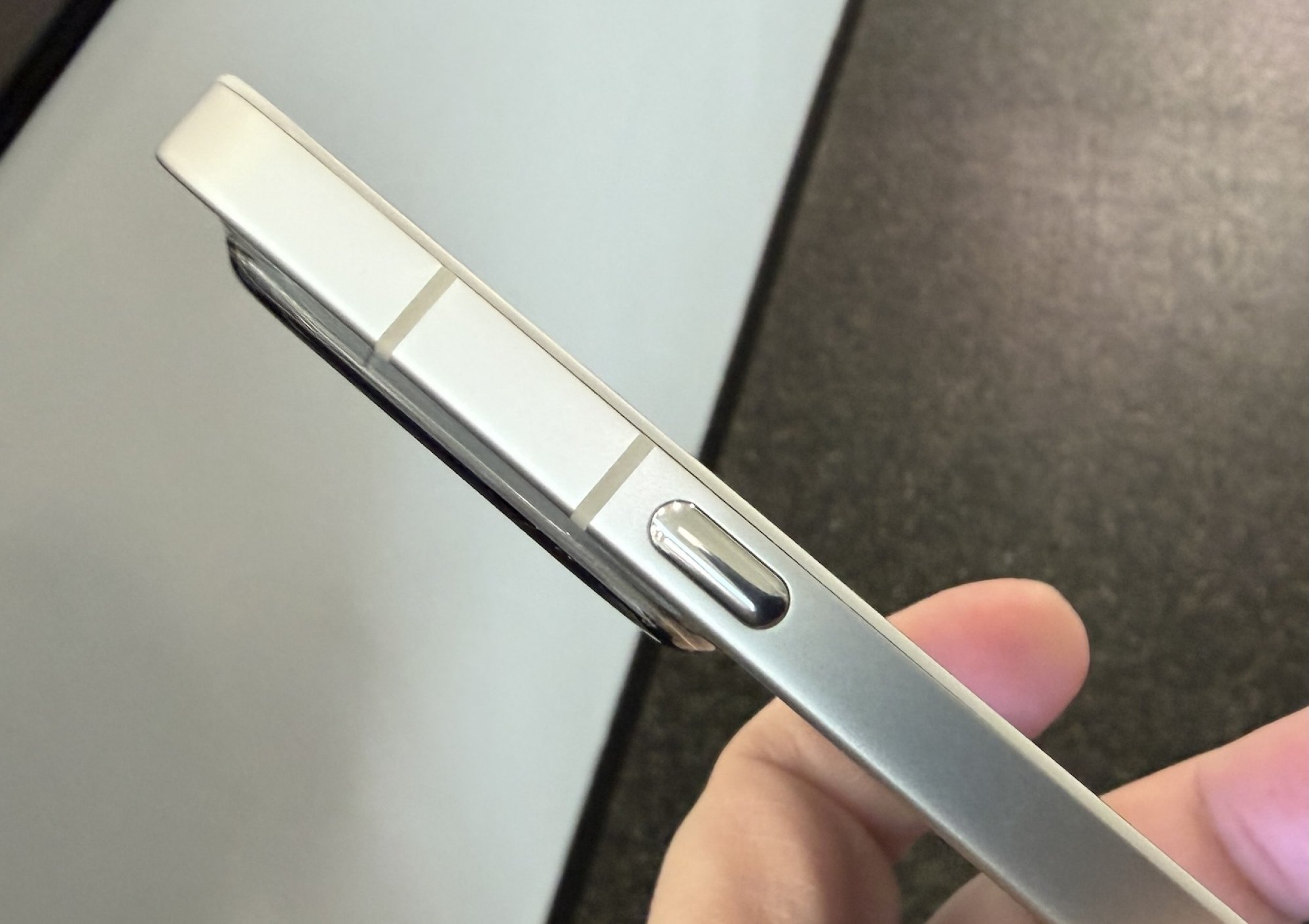 the side of the Nothing Phone with the Essential button