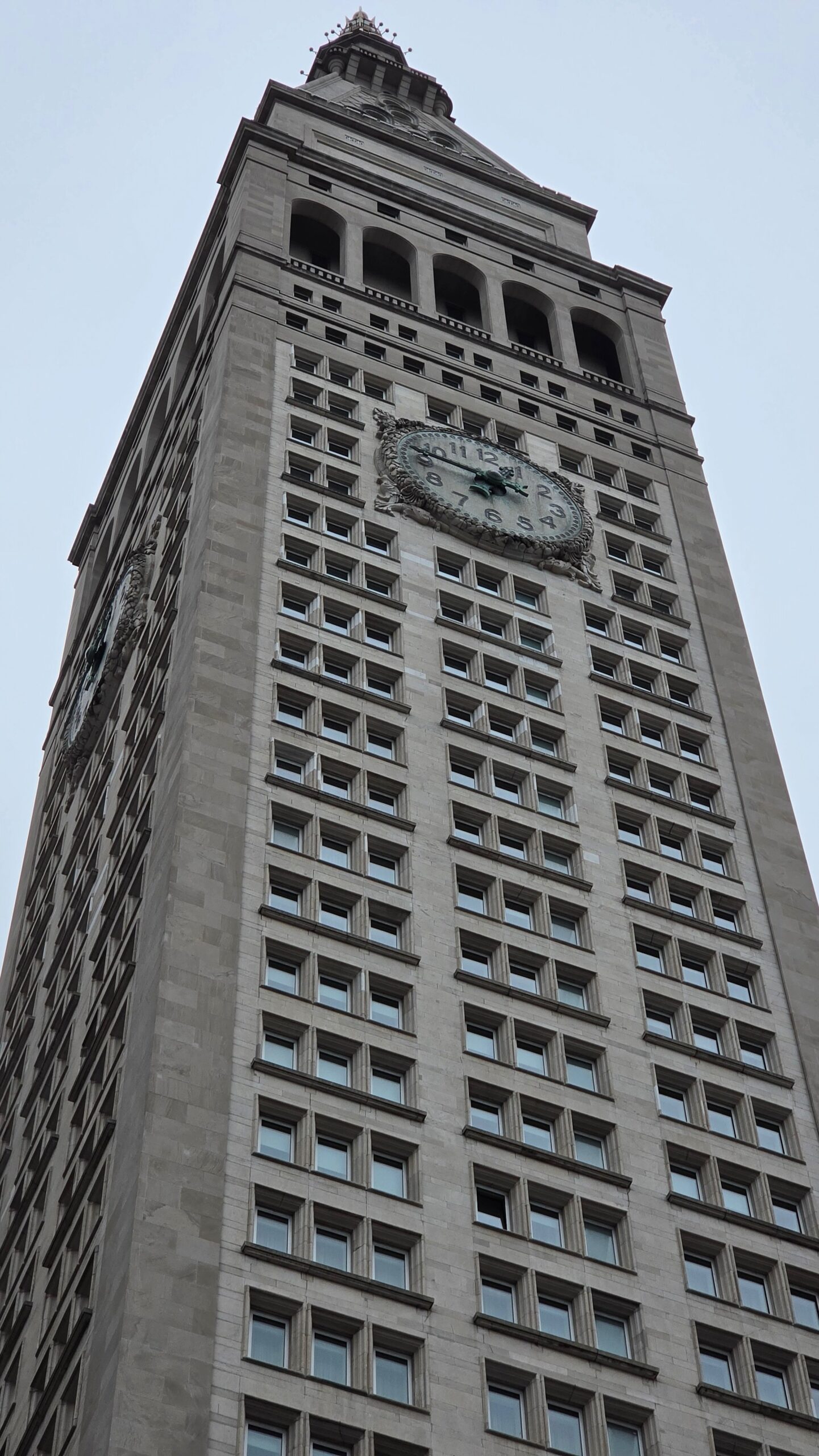 a skyscraper in new york city with old-fashioned clock