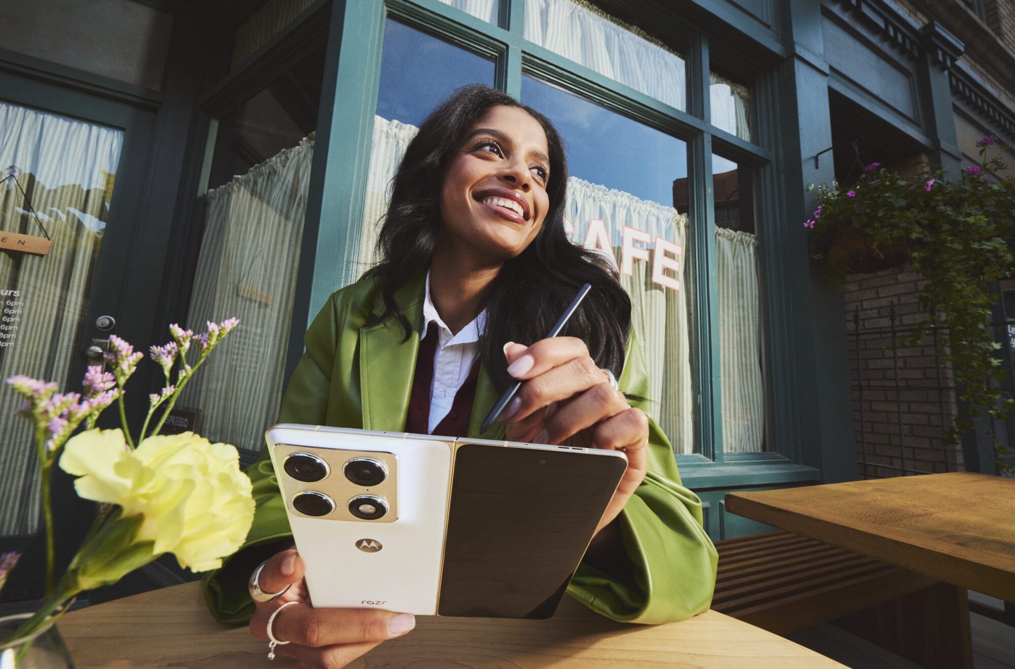 woman using motorola razr fold with moto pen