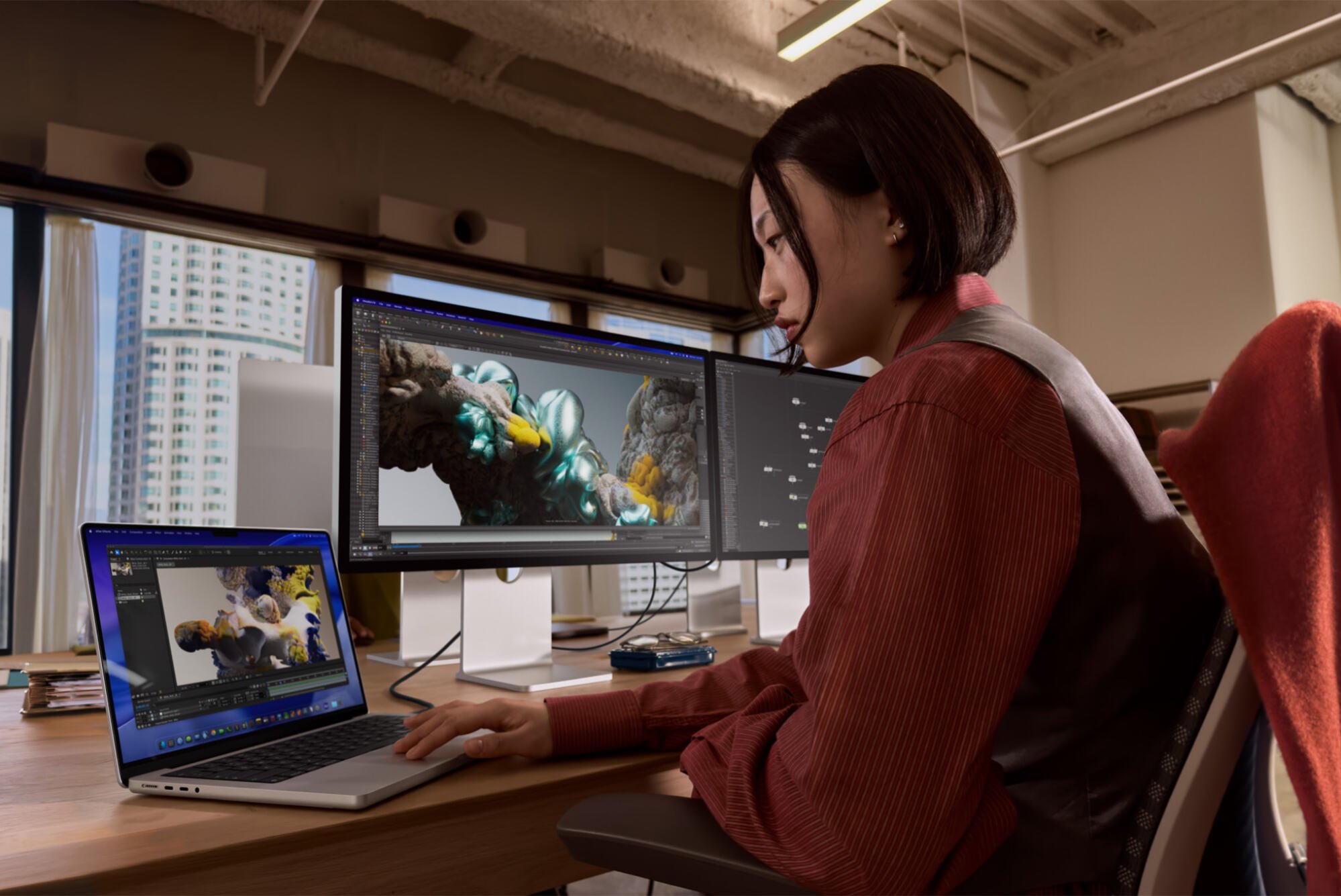 a woman working on a new macbook pro