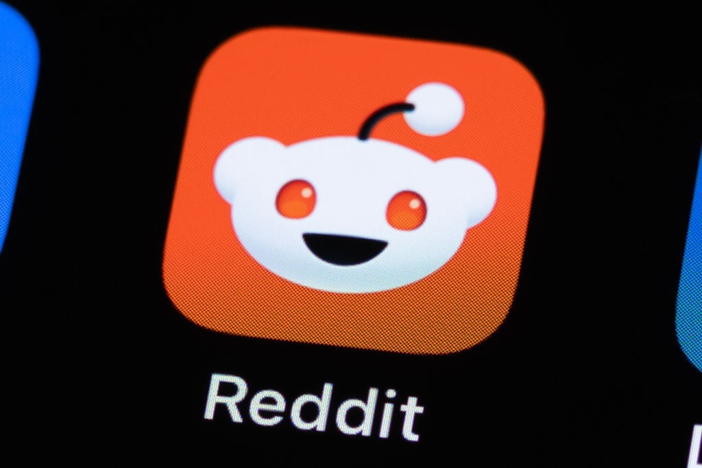 Reddit logo on phone screen