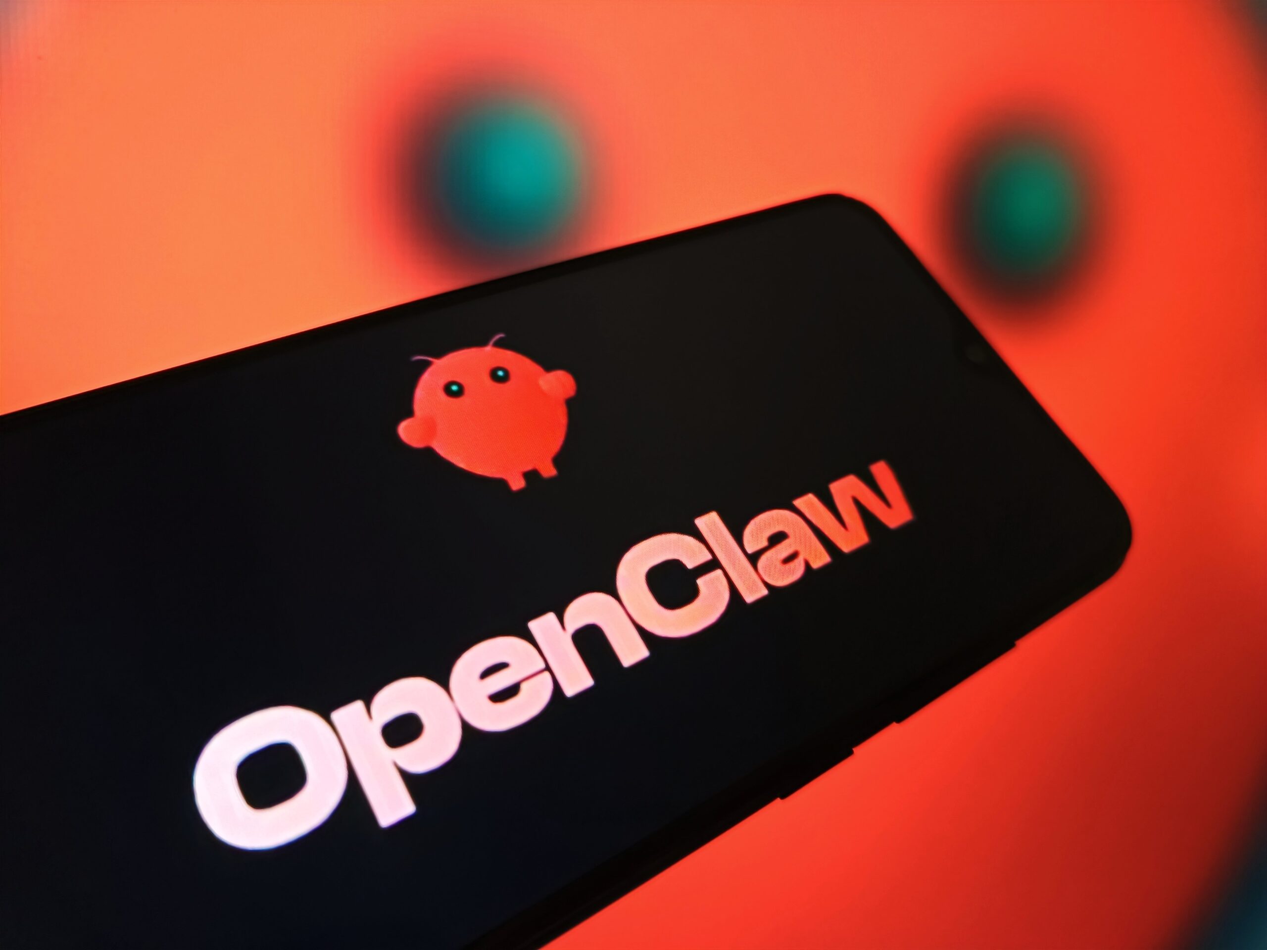 the logo of open-source AI agent OpenClaw is displayed on a smartphone screen
