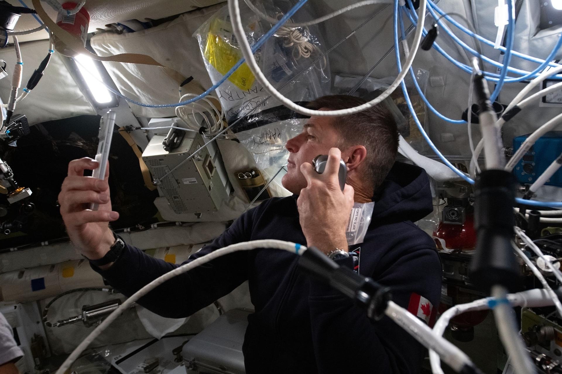 Artemis II mission specialist and CSA (Canadian Space Agency) astronaut Jeremy Hansen enjoys a shave inside the Orion spacecraft