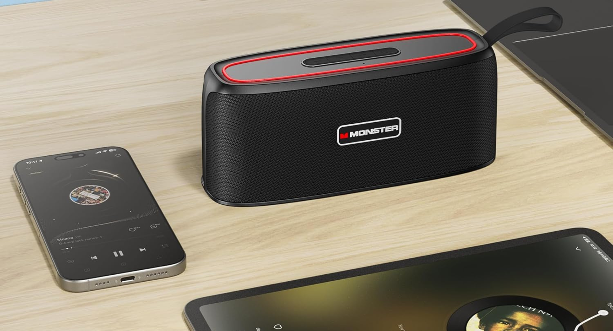 A Monster Shock Portable Bluetooth Speaker sitting on a table. 