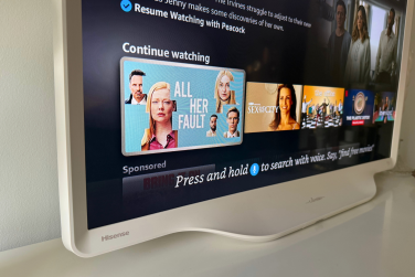 Hisense D&eacute;co TV's curved edges and Fire TV streaming apps on screen