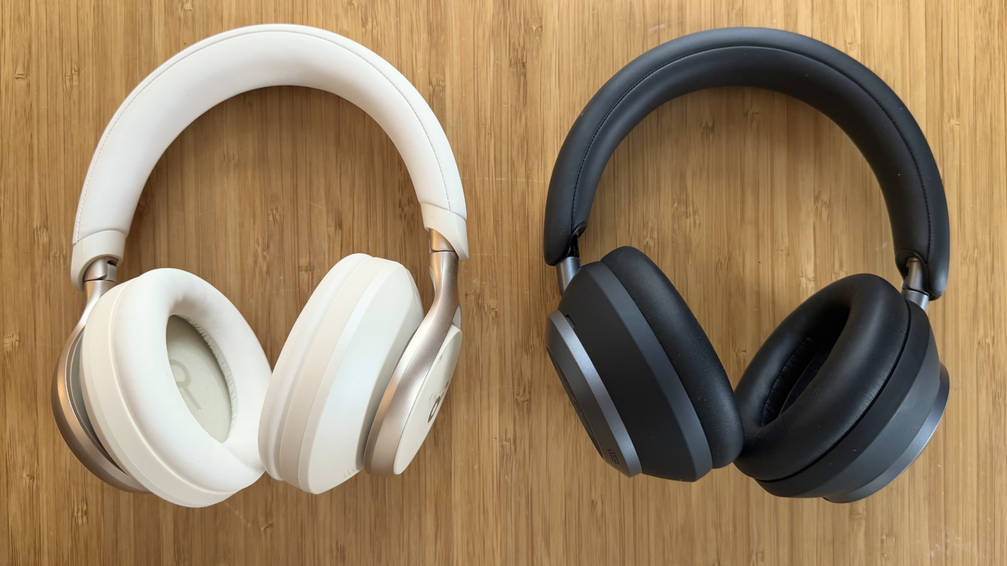 On the left, a pair of Soundcore Space One headphones and on the right, a pair of Space One Pro headphones.