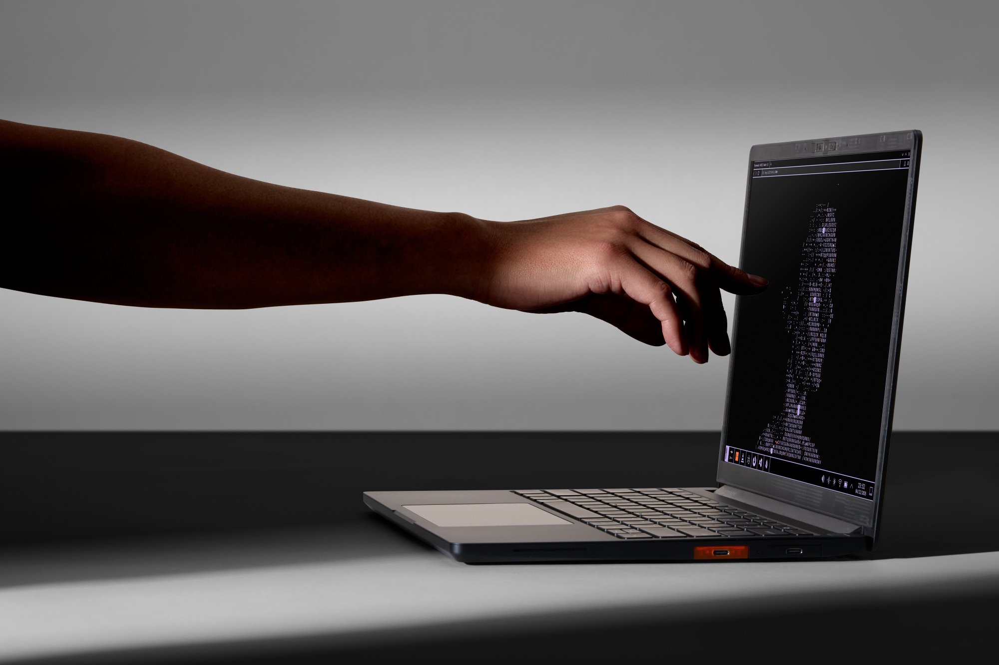a person touching the screen of the framework laptop 13 pro