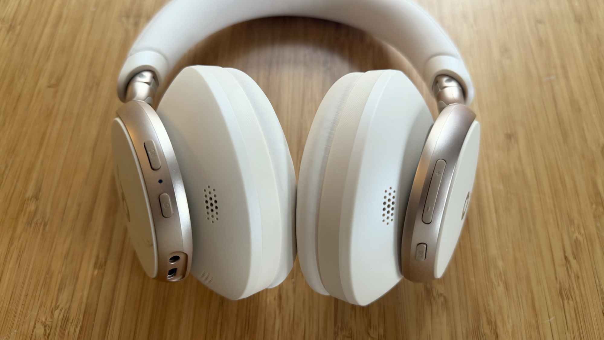 A close up of the controls of the Soundcore Space One headphones