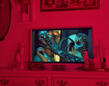 Hisense D&eacute;co TV sitting on dresser while playing a scene from "Rosario"