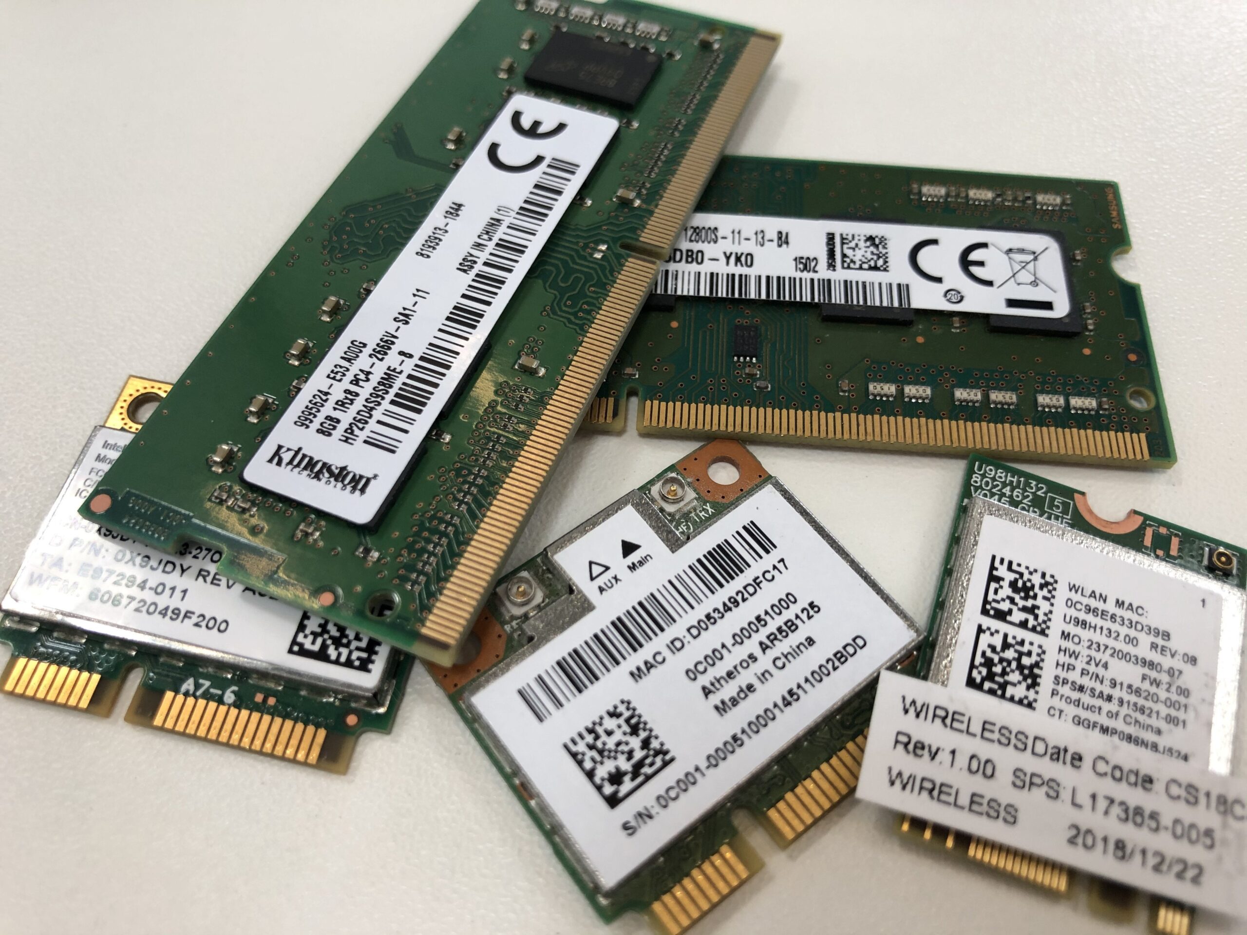 Kingston logo silicon random access memory RAM and wireless wifi microchips with white table surface background