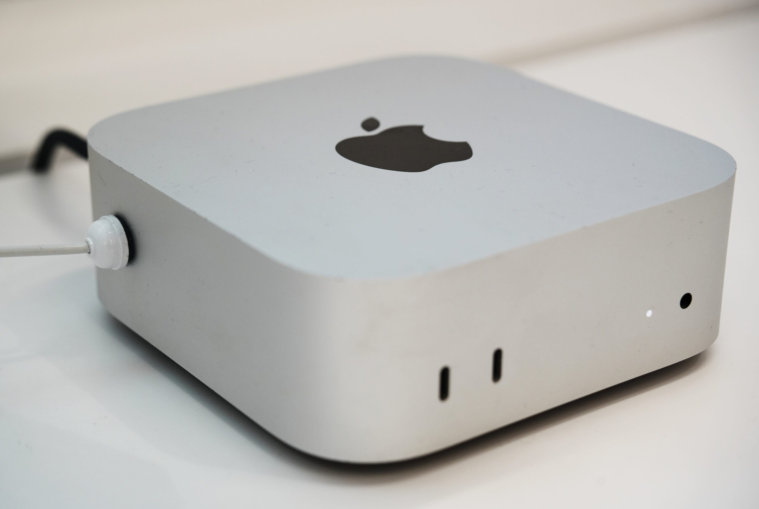 A compact, square shaped Mac Mini.