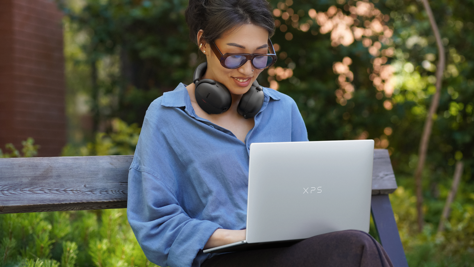 a woman typing on the dell xps 13
