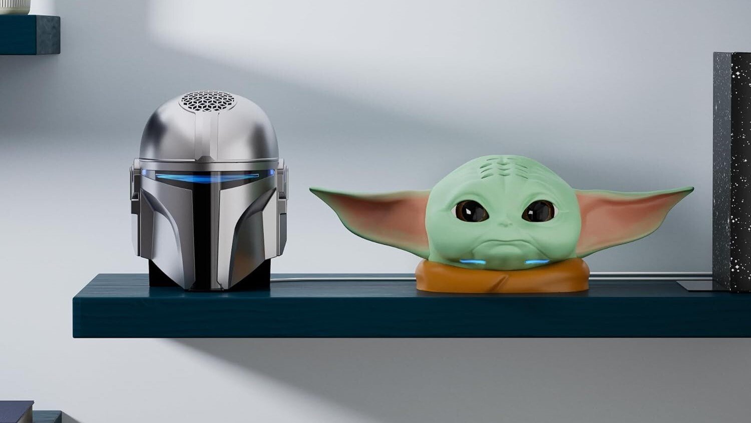 the The Mandalorian & Grogu echo dot stands sitting on a shelf in a home