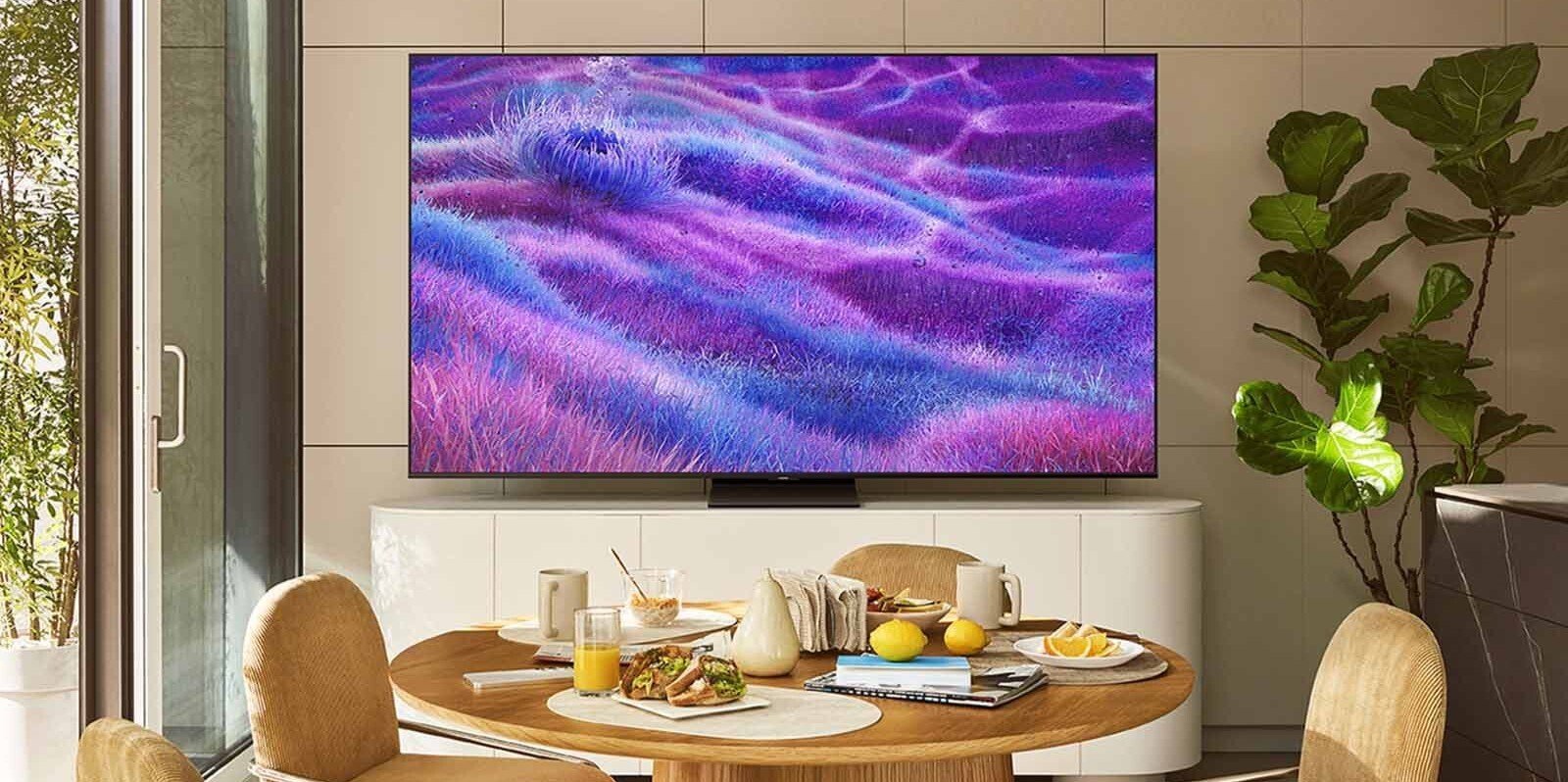 a 55-inch Samsung Neo QLED 4K TV sits in a front of a table inside of a home