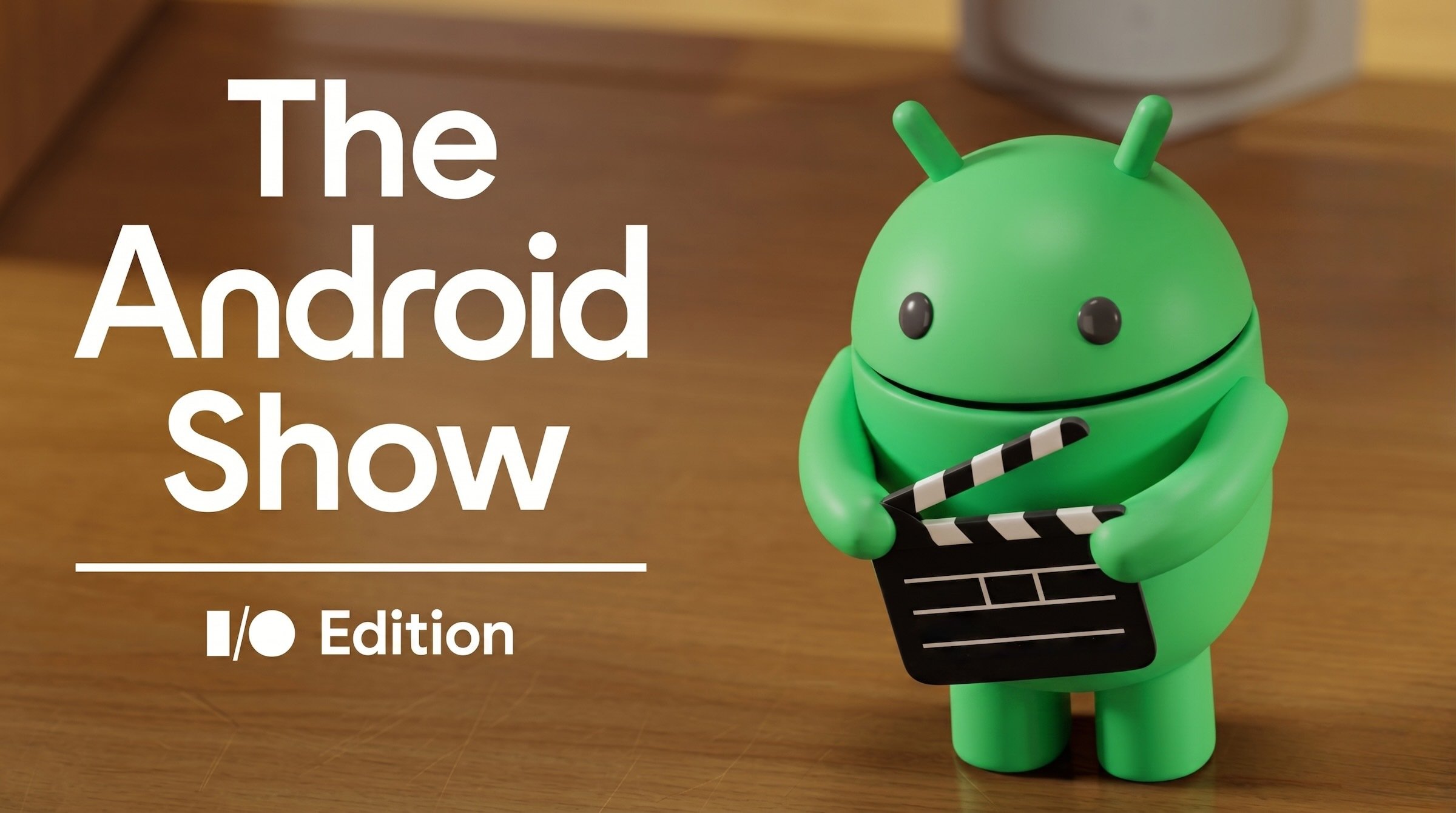 android mascot holding directors slate with text that reads 'the android show'