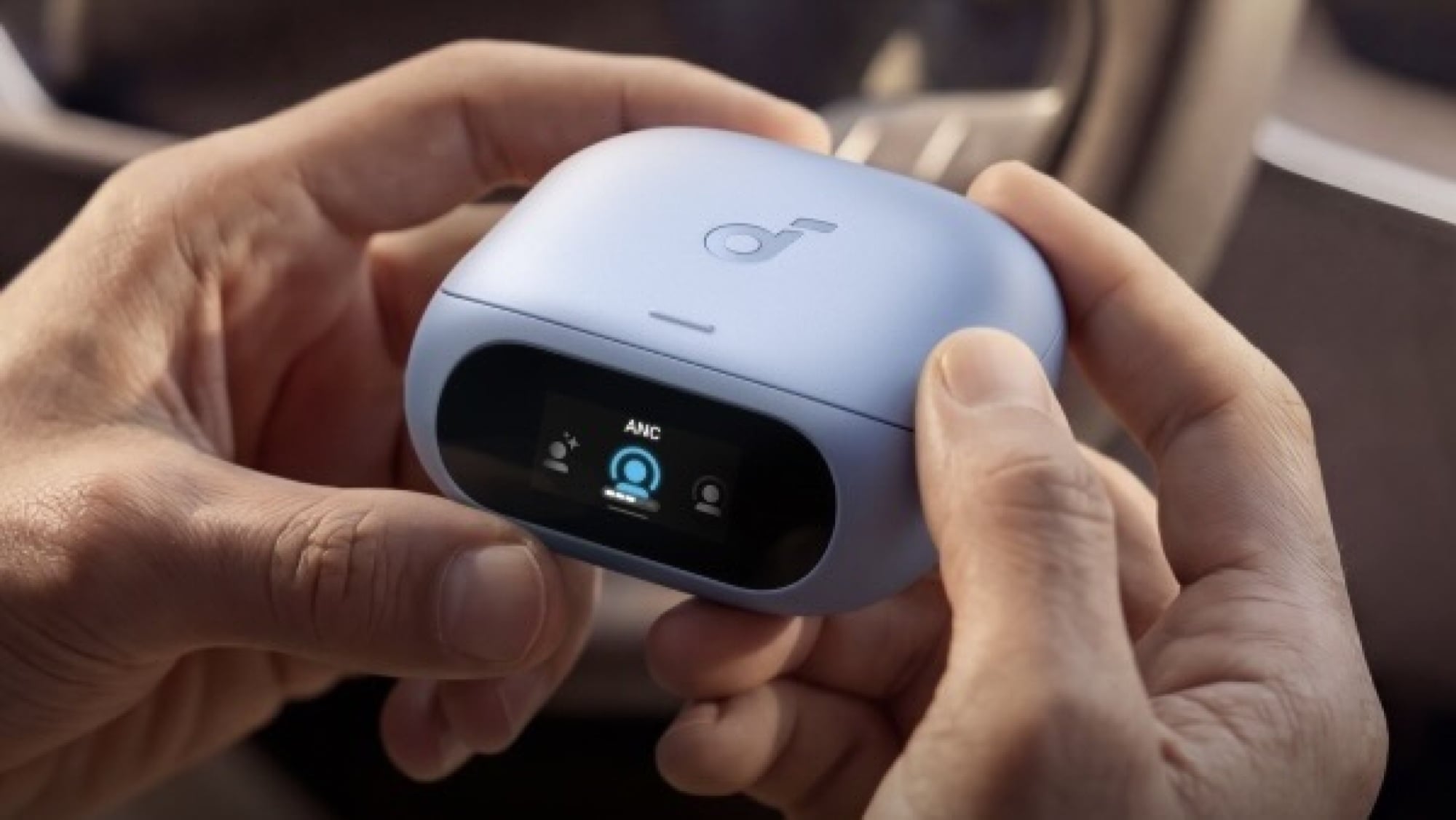 person holding soundcore case