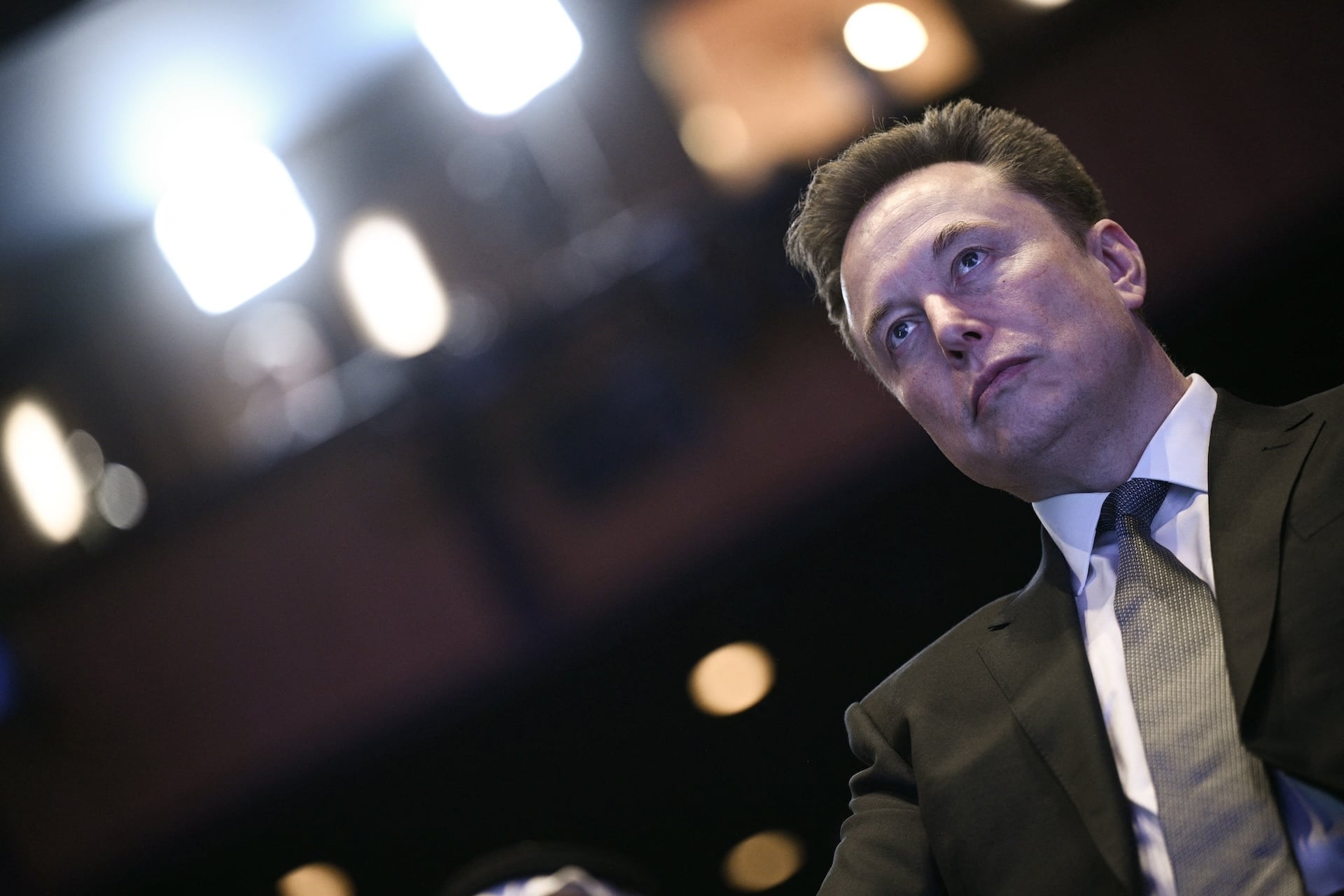 Elon Musk, SpaceX CEO, looking into the distance. 