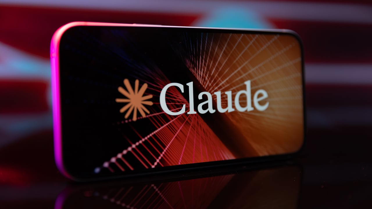claude logo and name appears on a smartphone screen with colorful lights in background