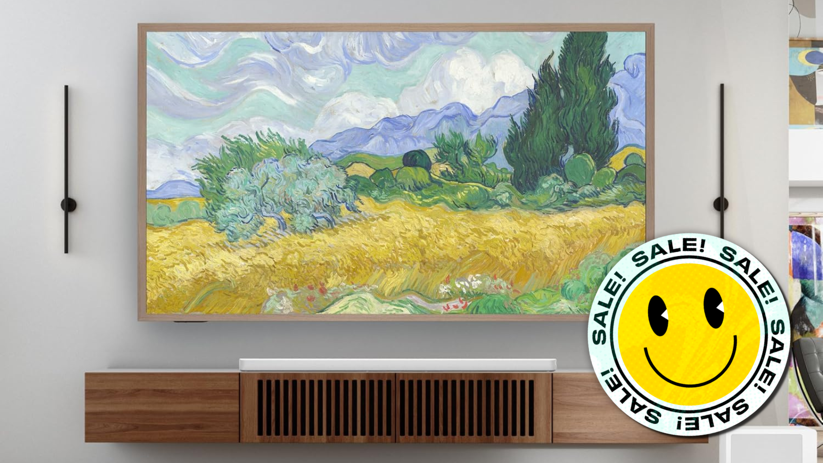 Hisense Canvas TV mounted on wall with smiley face deal sticker in corner
