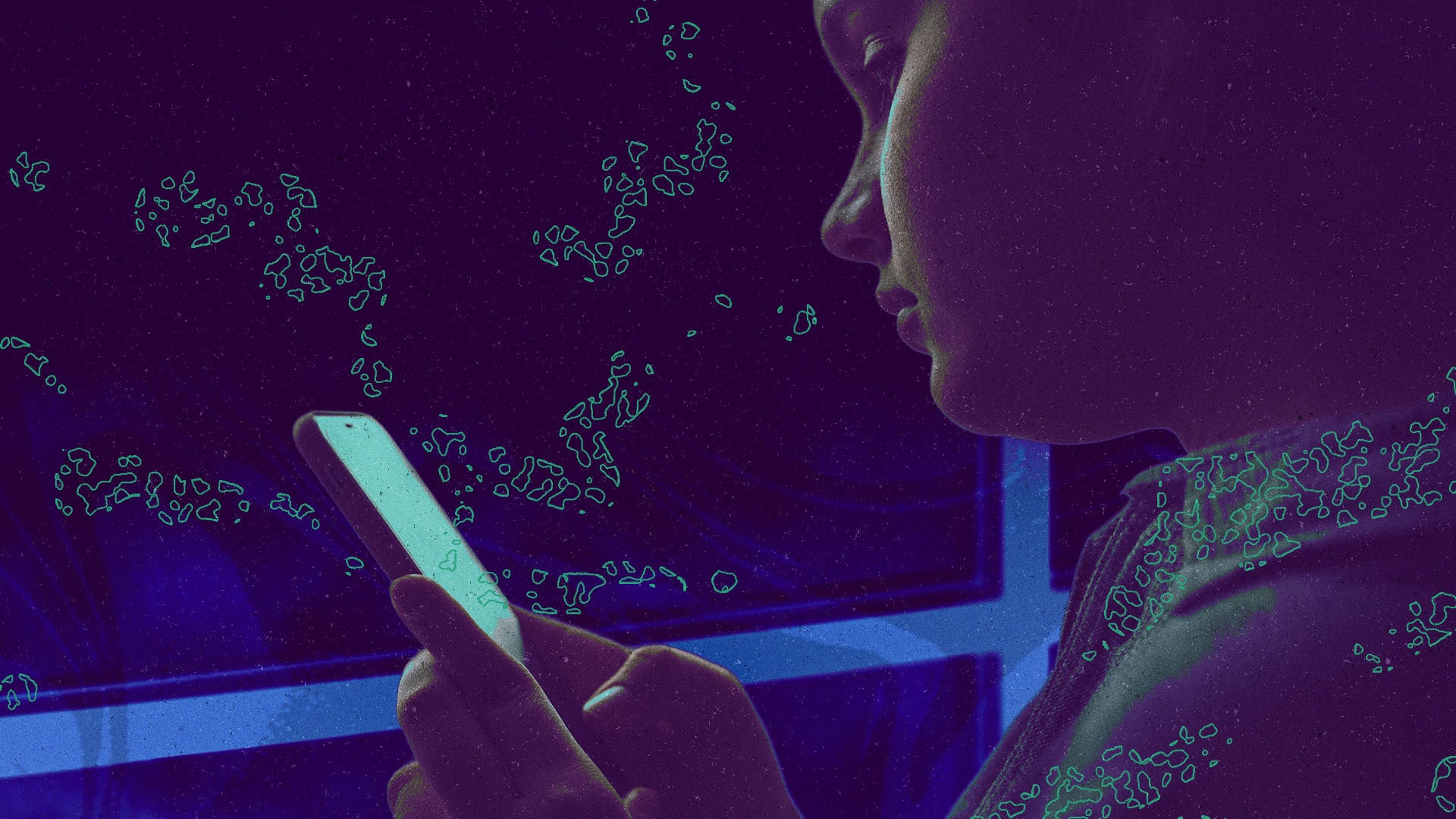 A child looks at a phone screen.