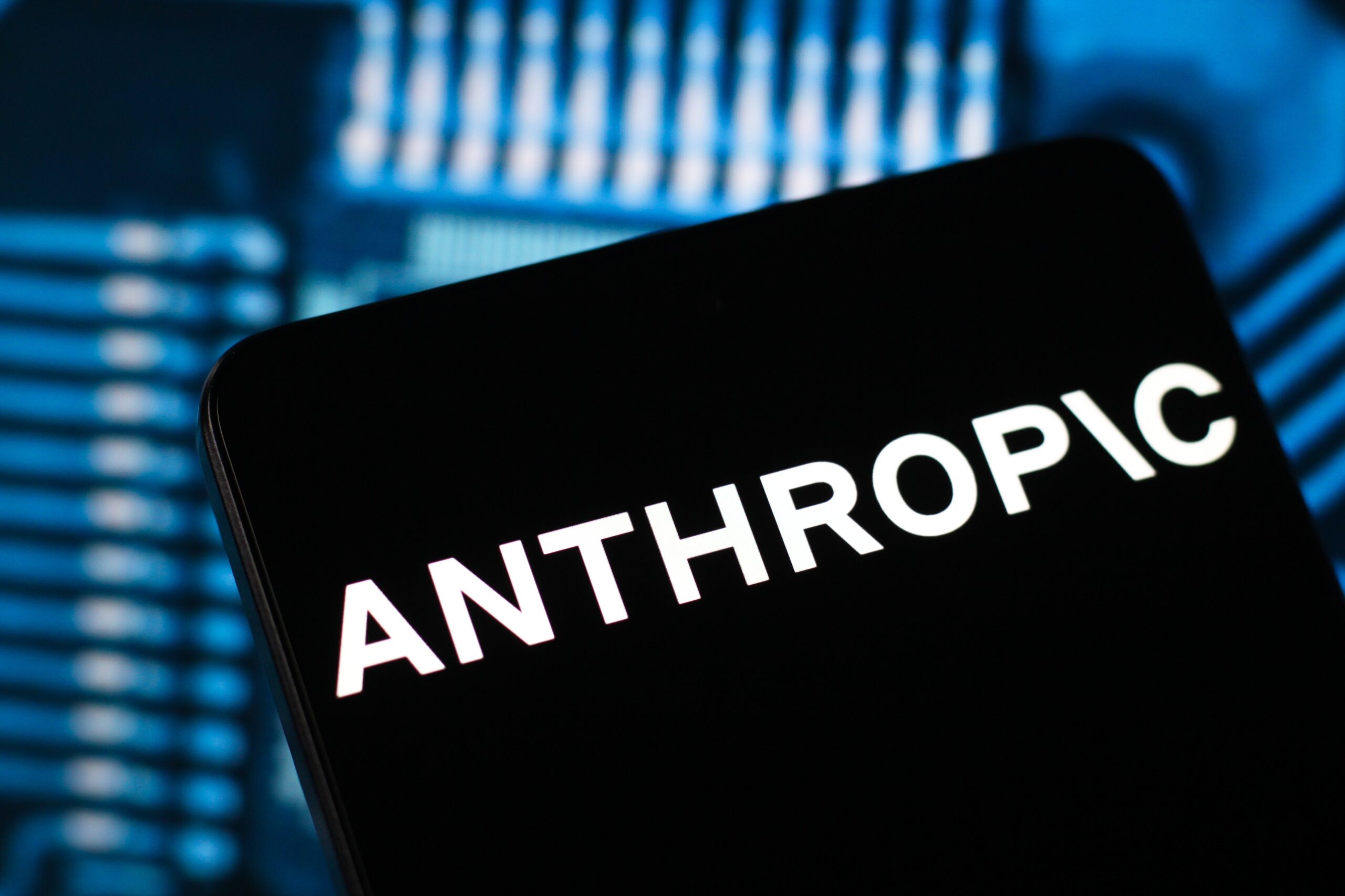 the Anthropic logo is seen displayed on a smartphone screen.