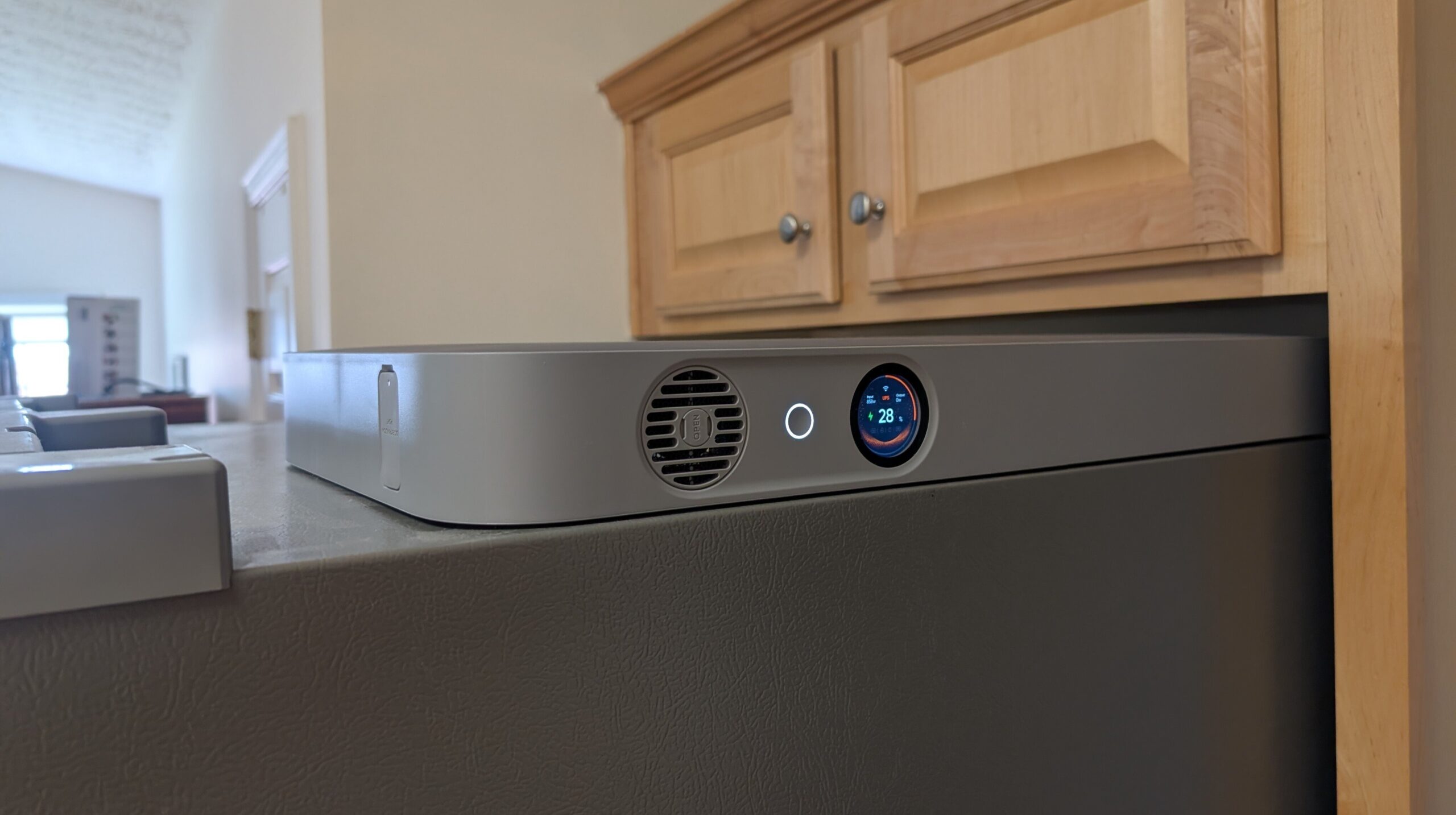 the Jackery FridgeGuard power station on top of a fridge