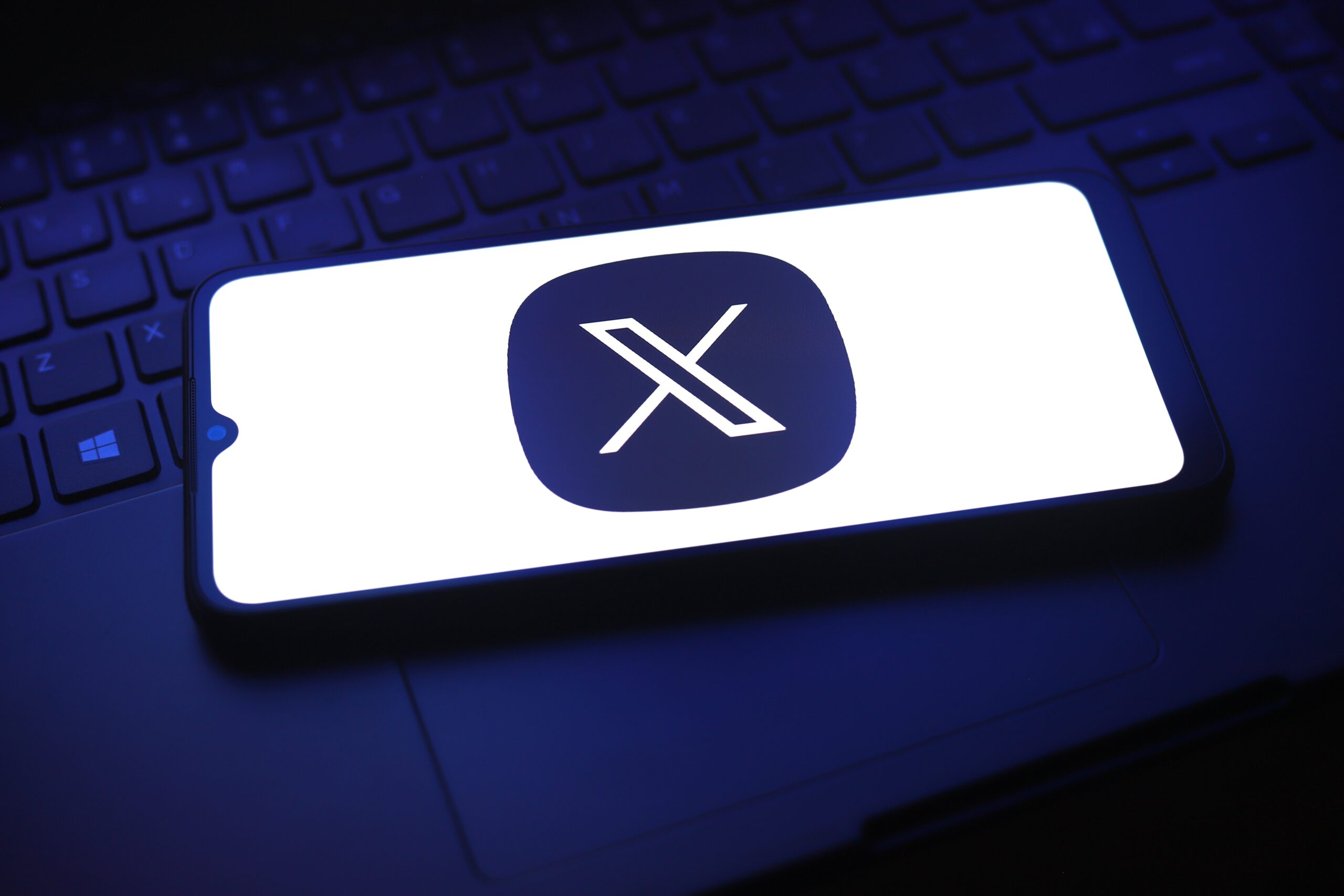 X logo on mobile device
