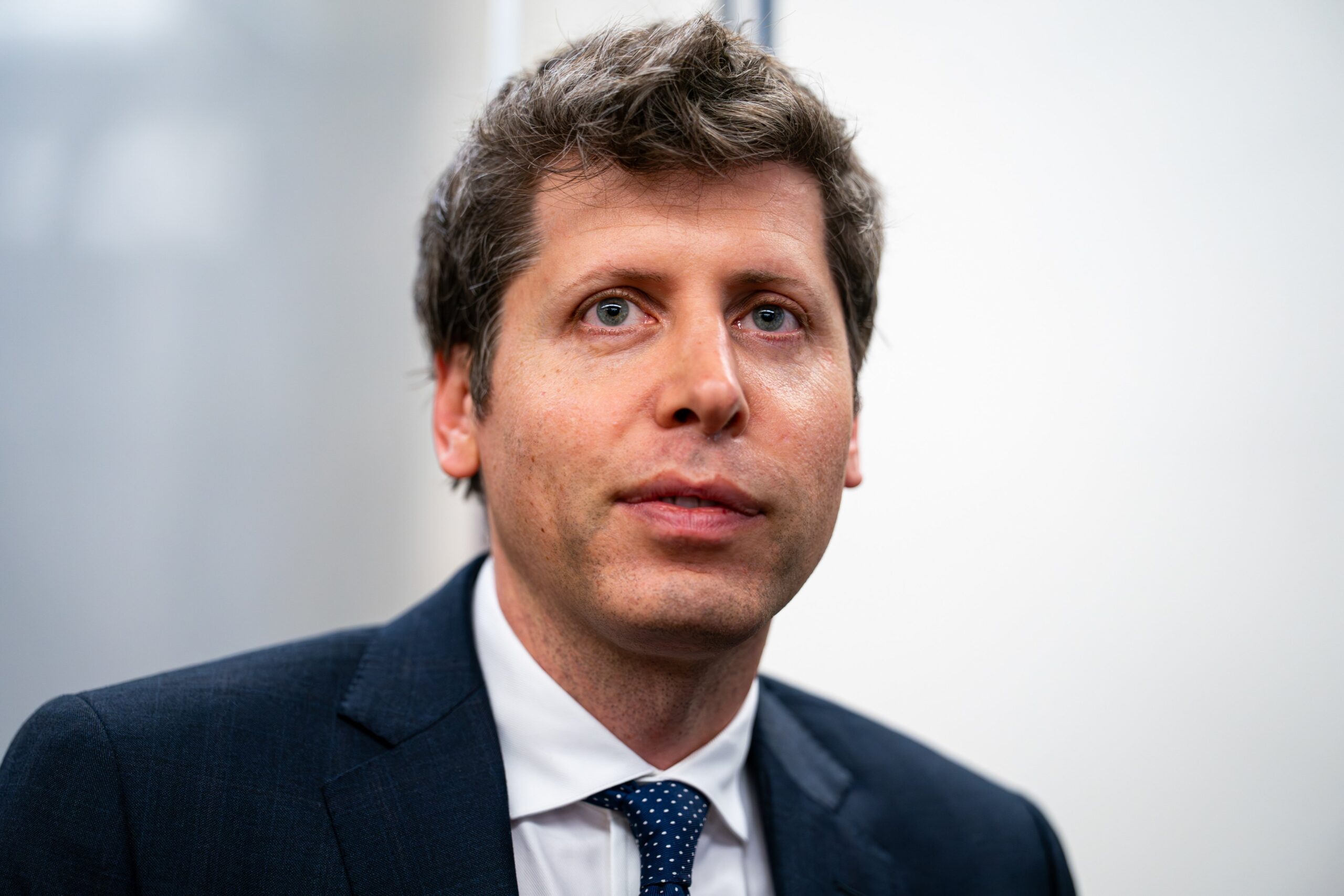 sam altman in a suit
