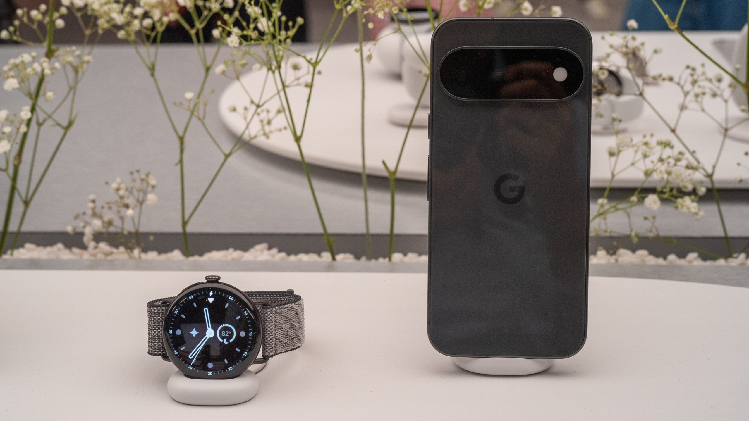 Pixel Watch 5 and Pixel Pro sit on display stands