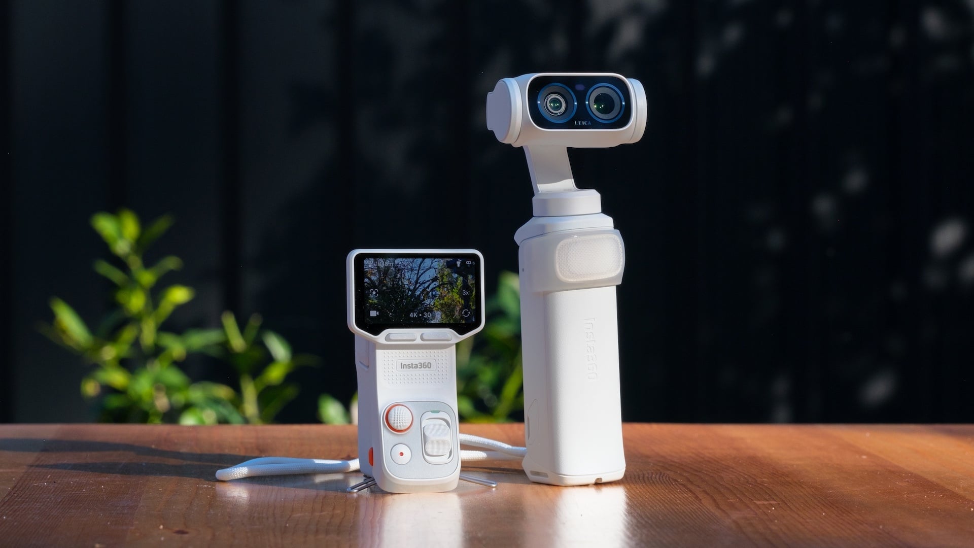 The Insta360 Luna Ultra in Stellar White next to its detached remote.