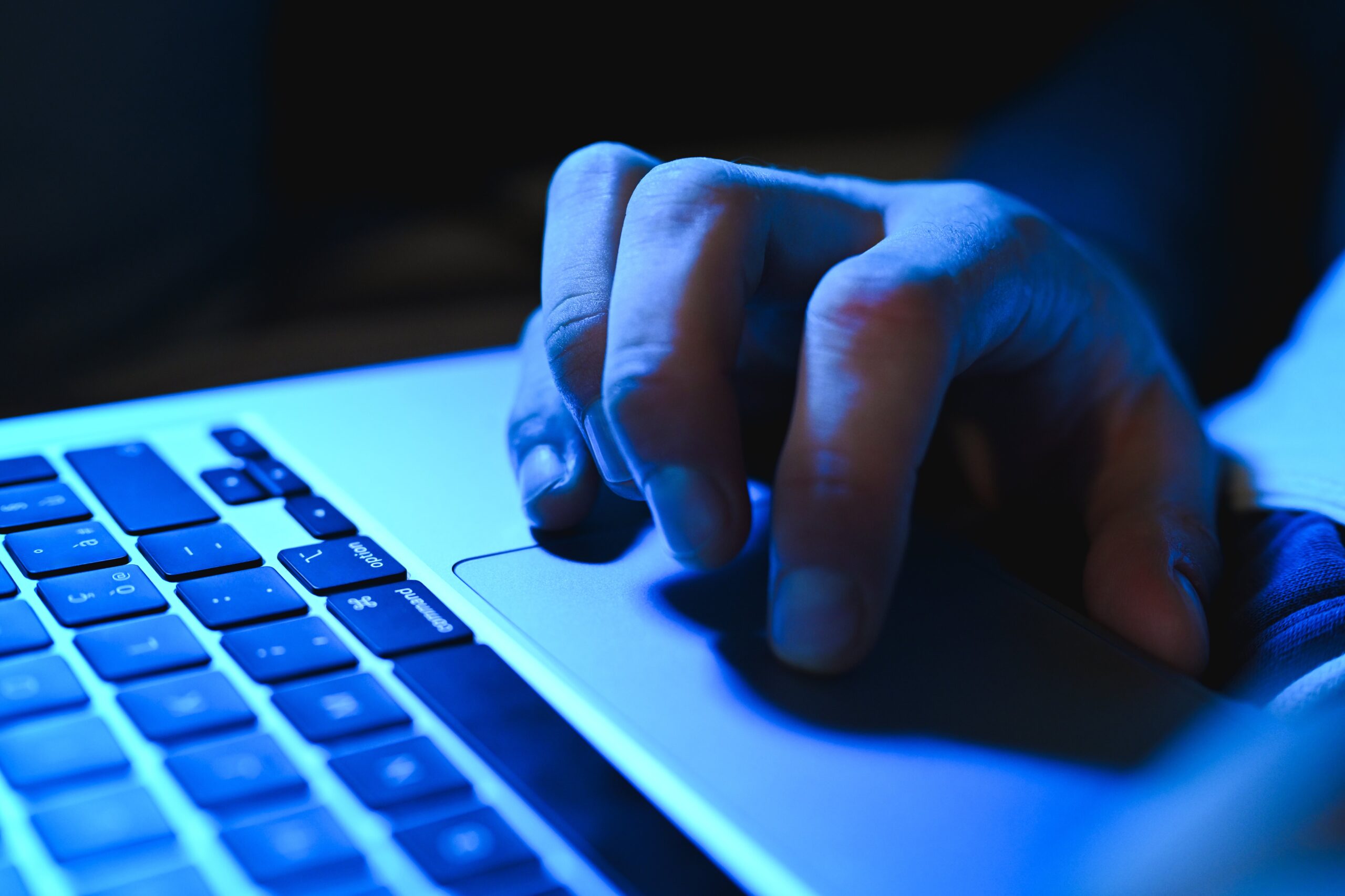 Mysterious hand using MacBook