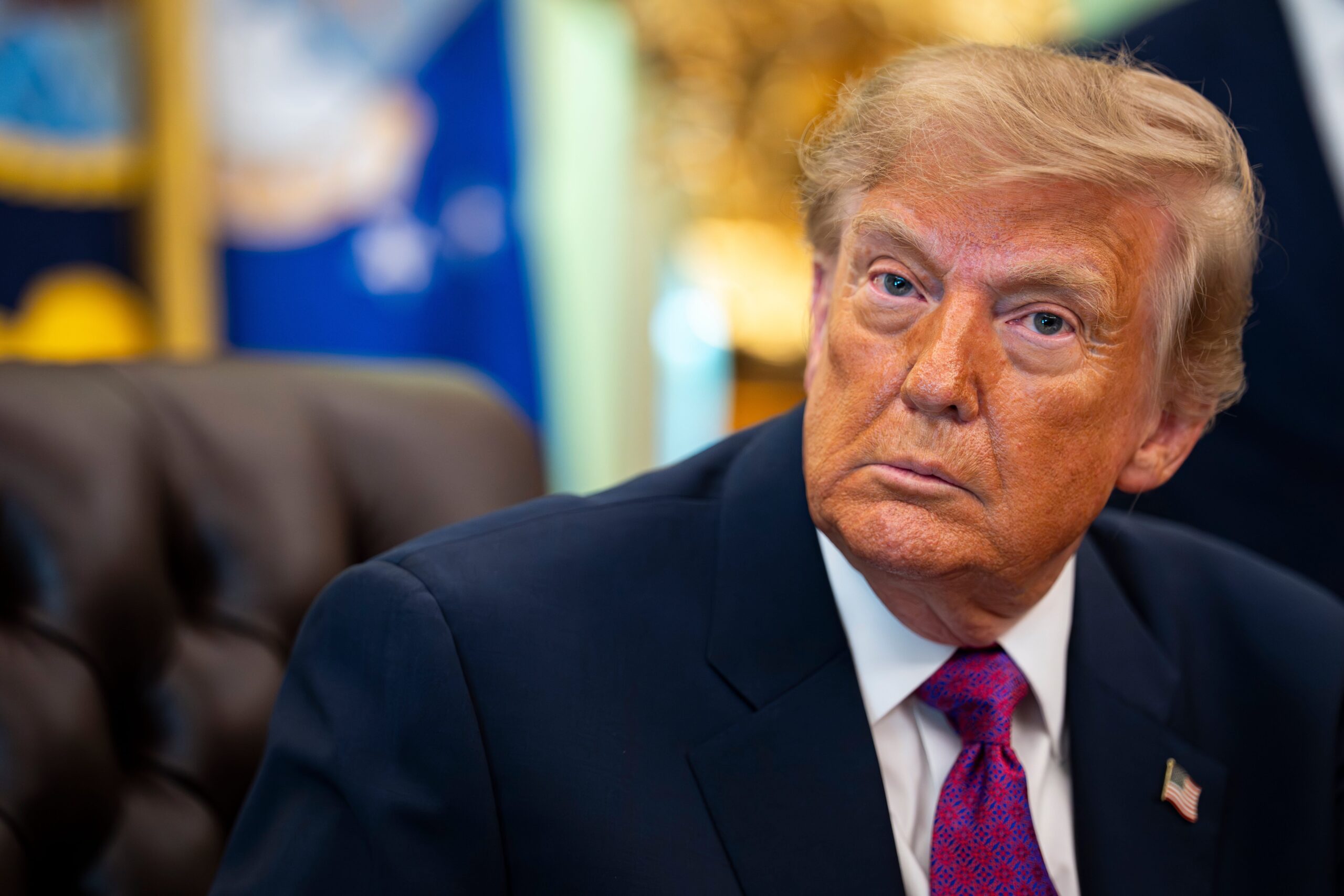 A close up shot of President Donald Trump staring directly into camera.
