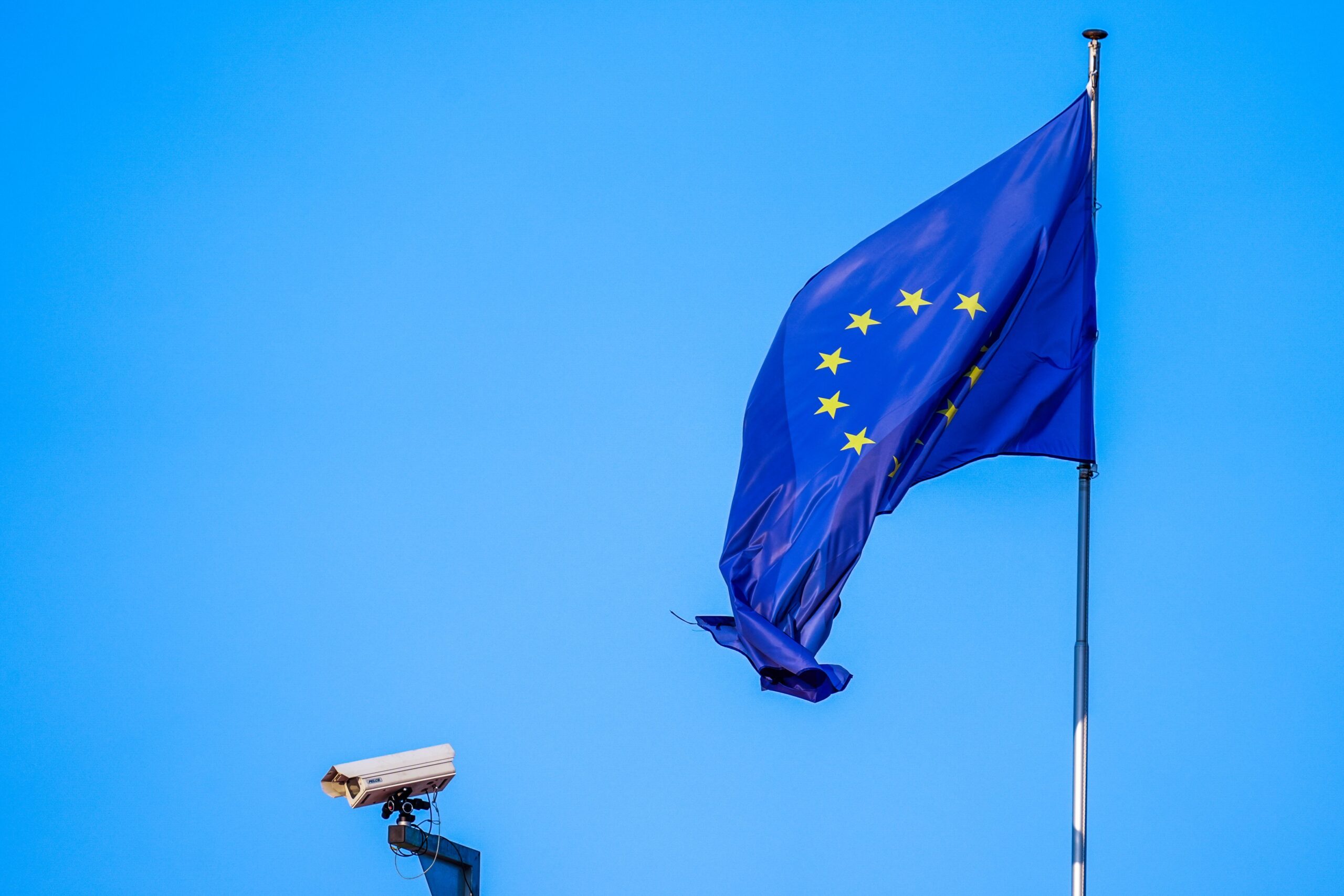 A European Union flag and a security camera are visible during the Coppa Italia 2026/27