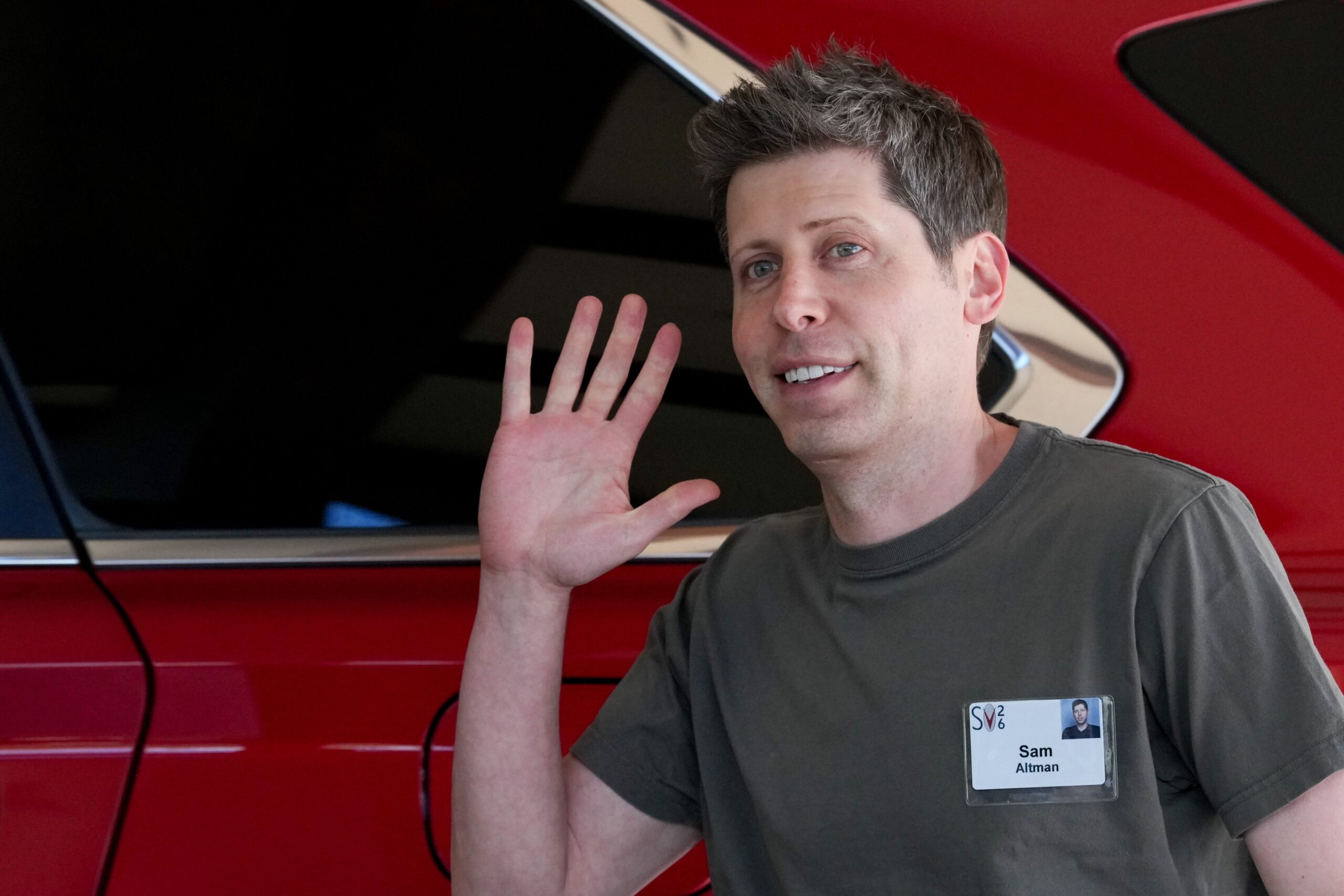 sam altman waving
