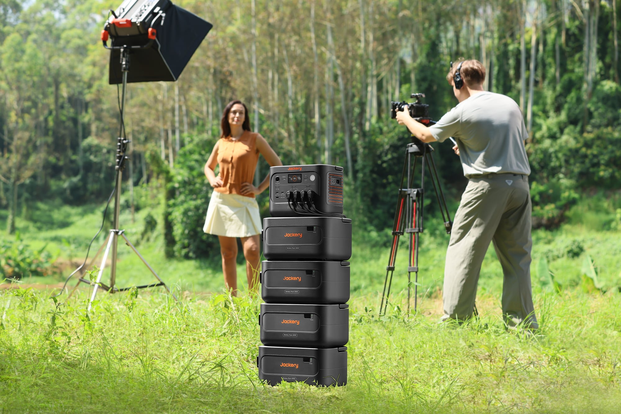 a person uses the jackery homepower 1000 plus v2 with expansion batteries during a photo shoot outside
