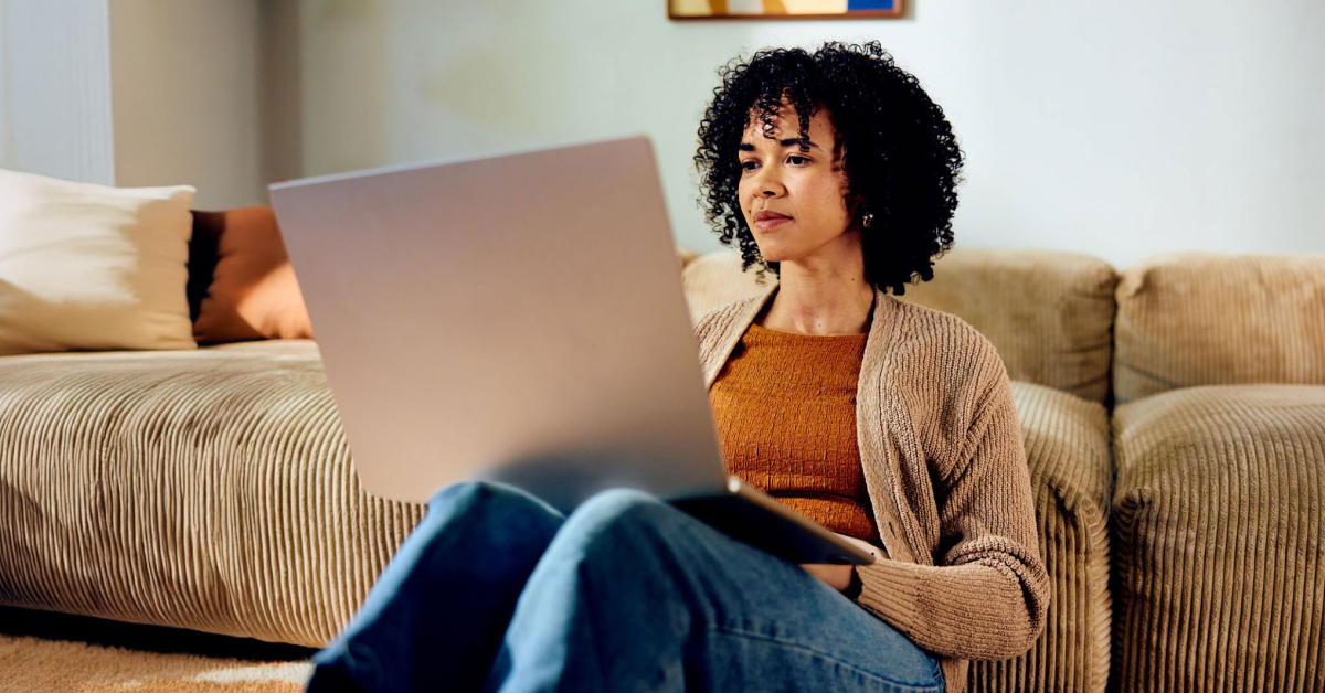 Person using McAfee on couch