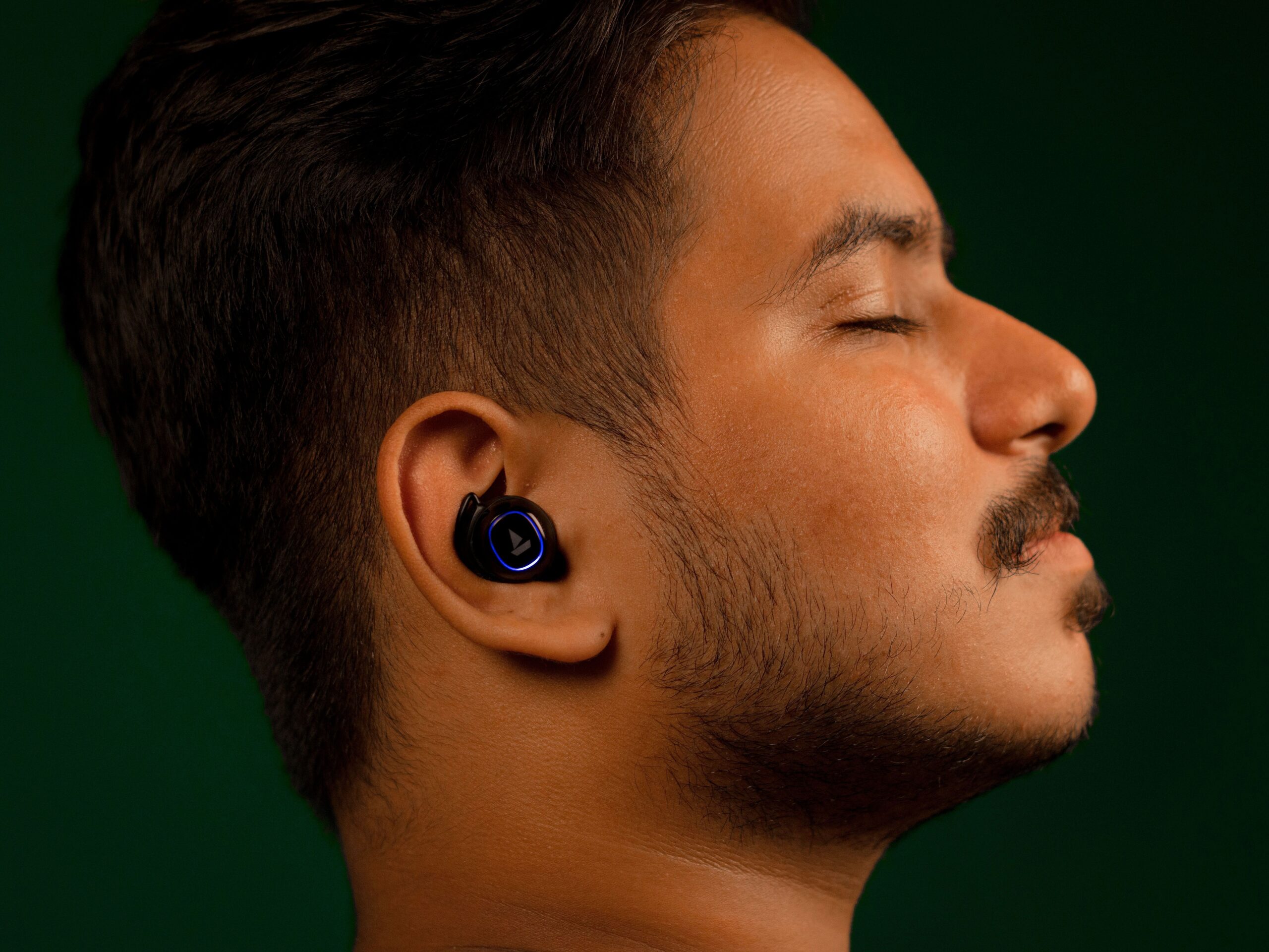 Earbuds in man's ears