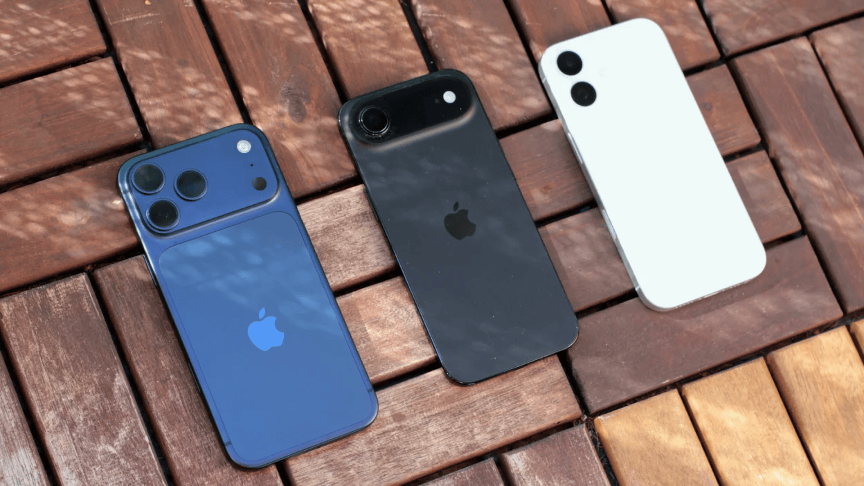 three iphones on a brick surface