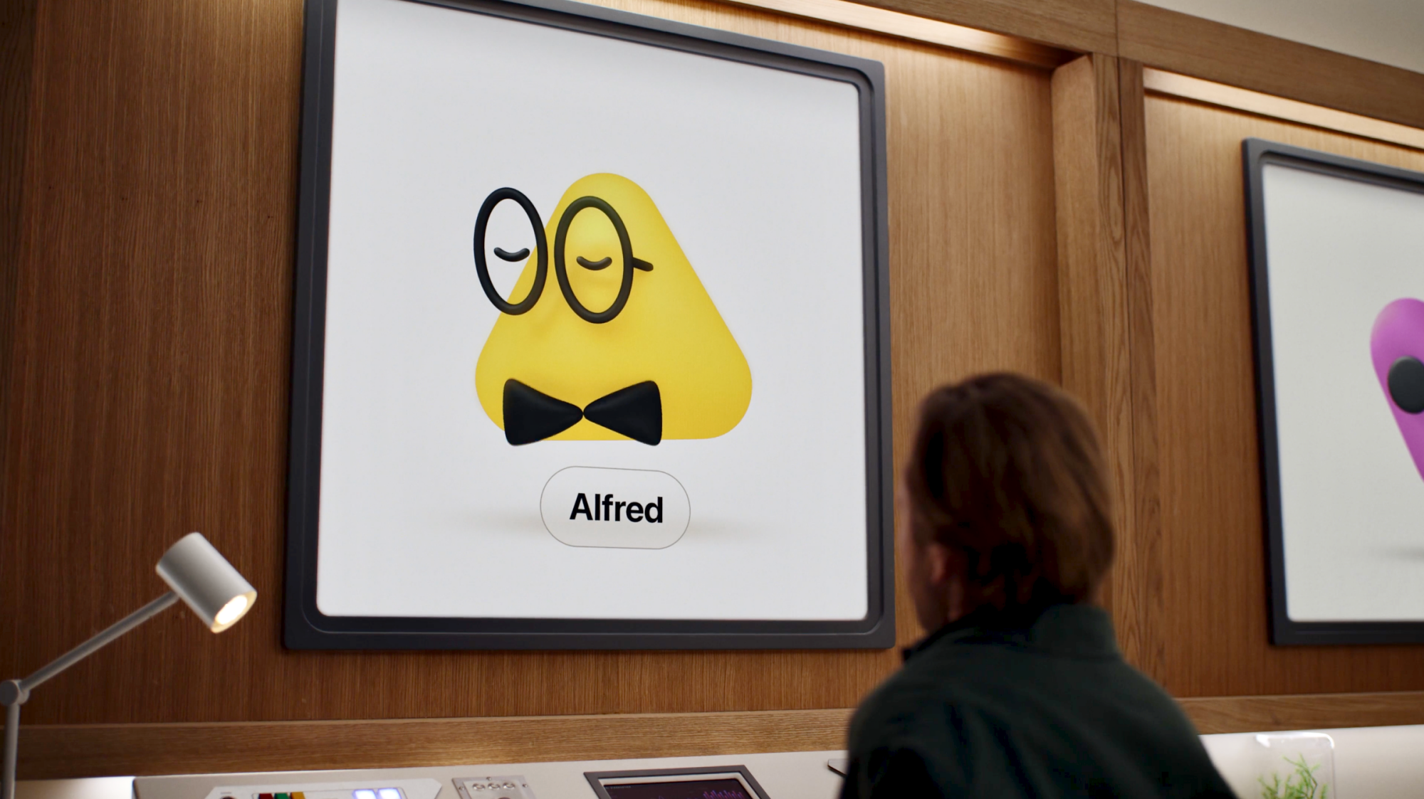 man looking at artwork of openai dots mascot
